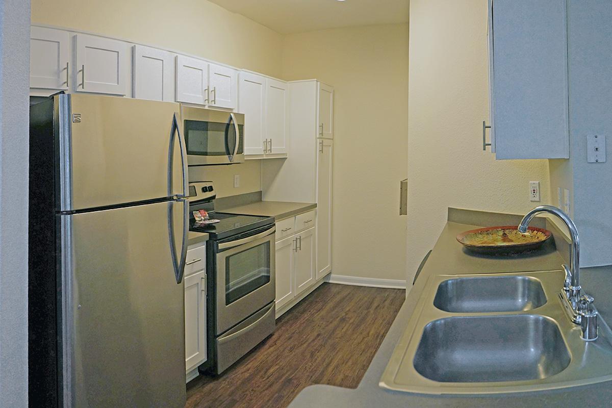 a stainless steel refrigerator in a kitchen