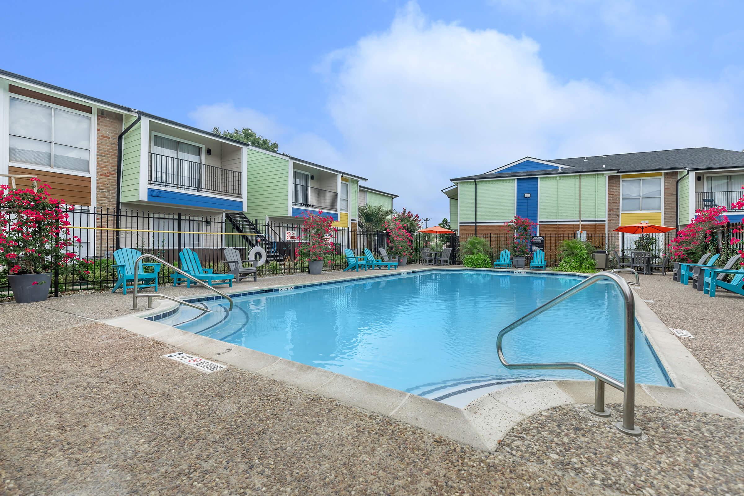 a large pool of water in front of a house