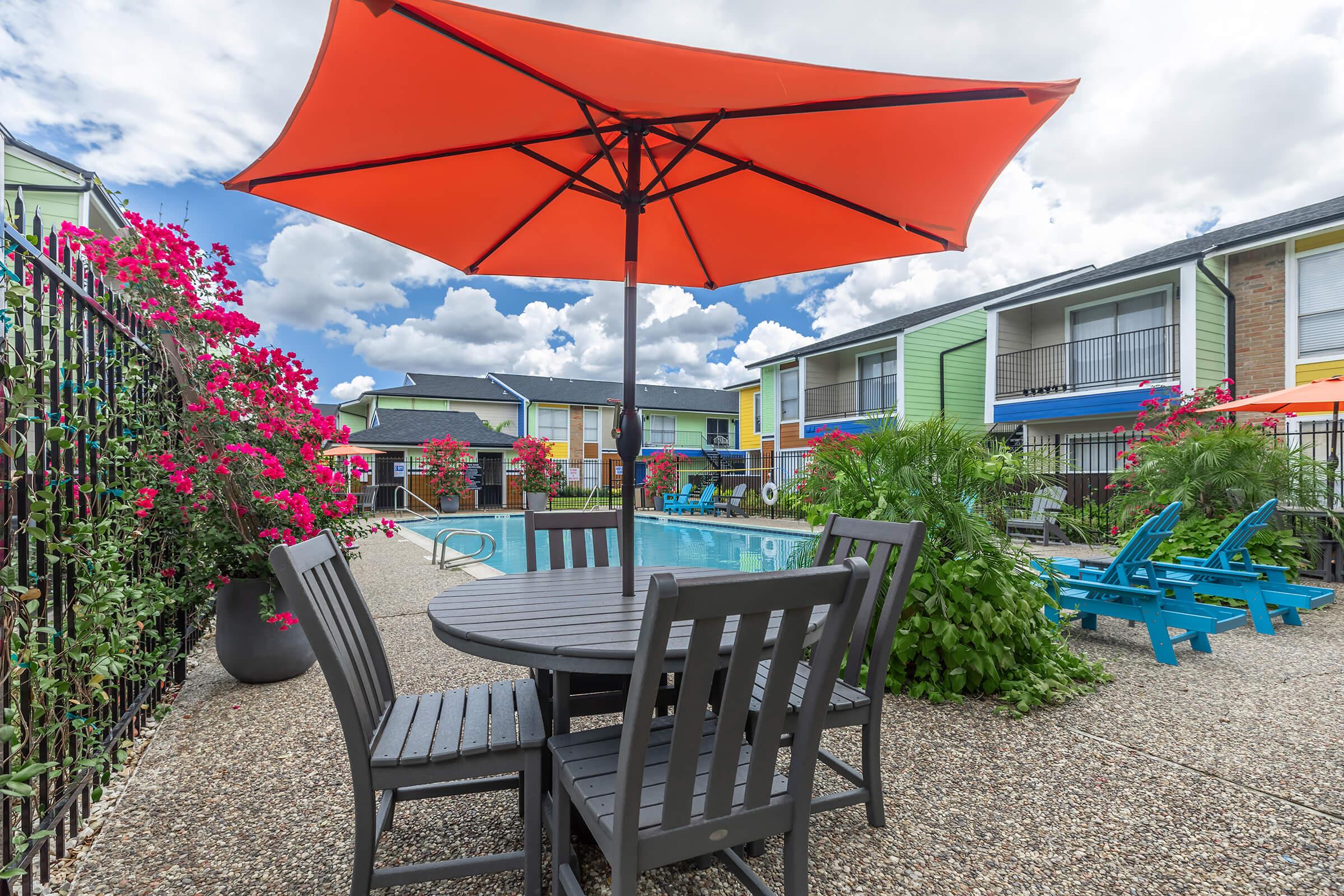 a table topped with a blue umbrella