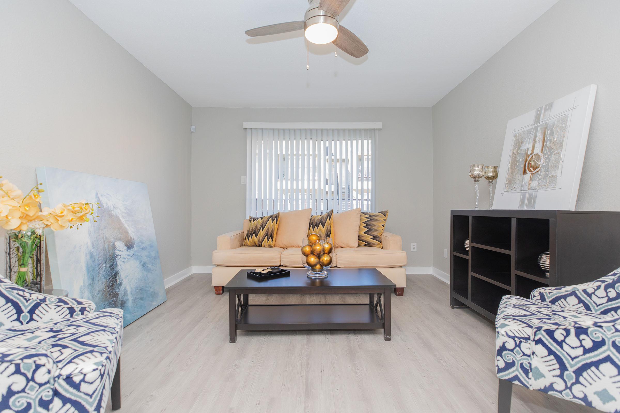 a bedroom with a bed and a couch in a living room