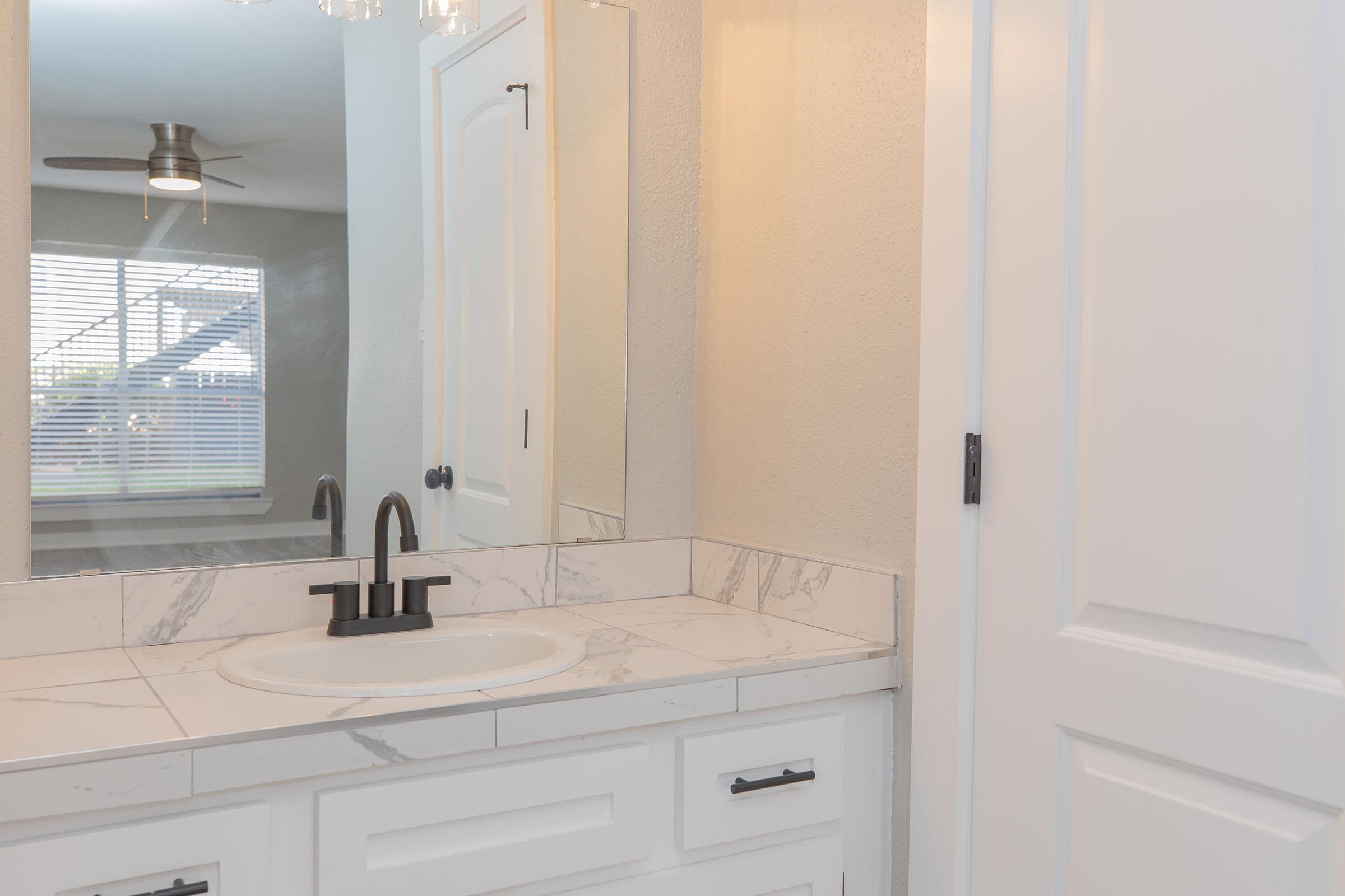 a kitchen with a sink and a window