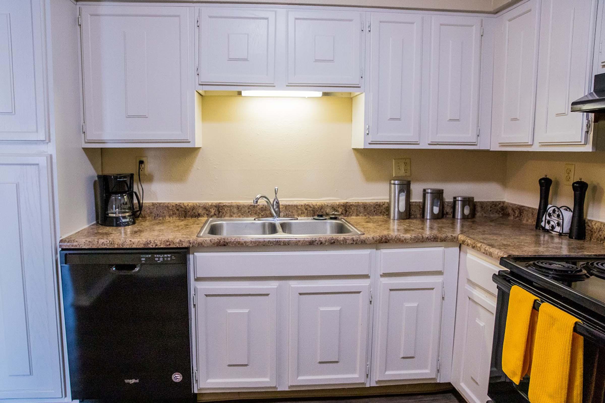 a kitchen with a sink and a microwave