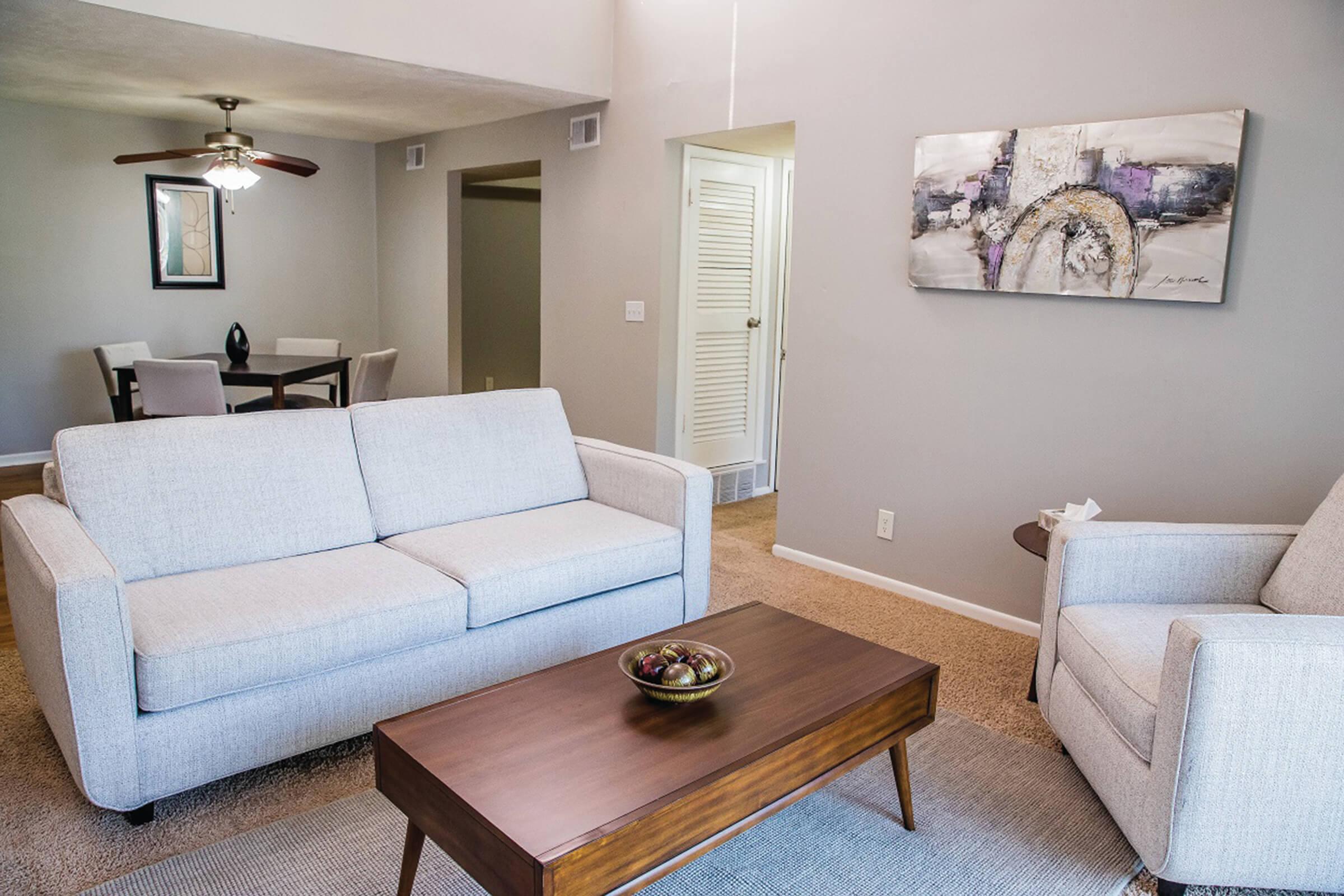 a bedroom with a bed and desk in a room