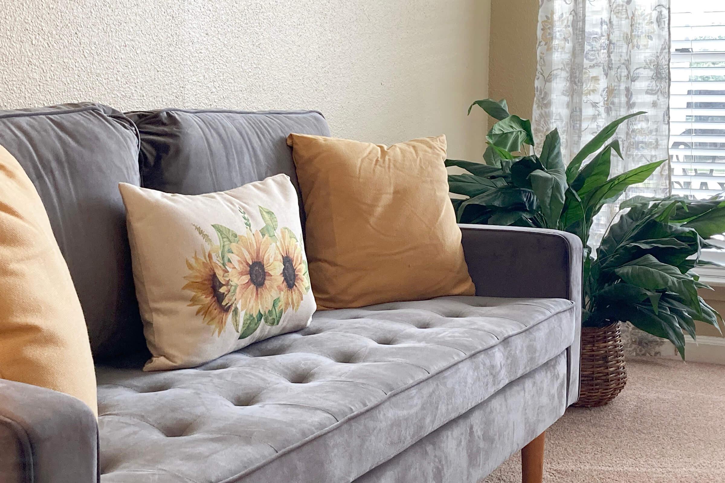 a green sofa in a living room