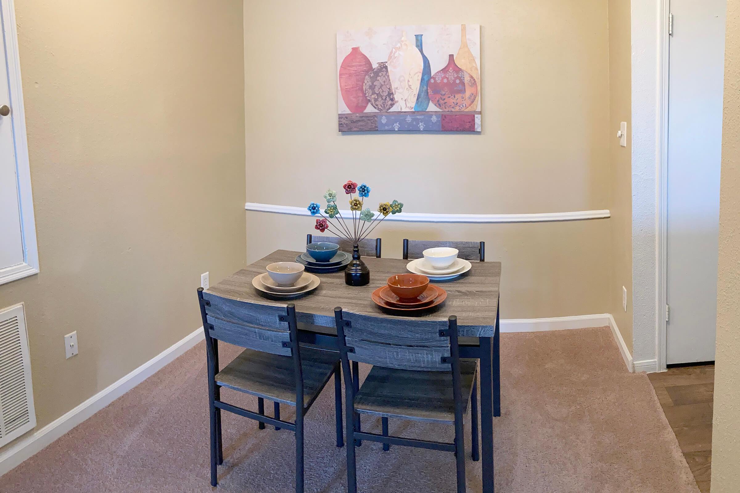 a kitchen with a table in a room