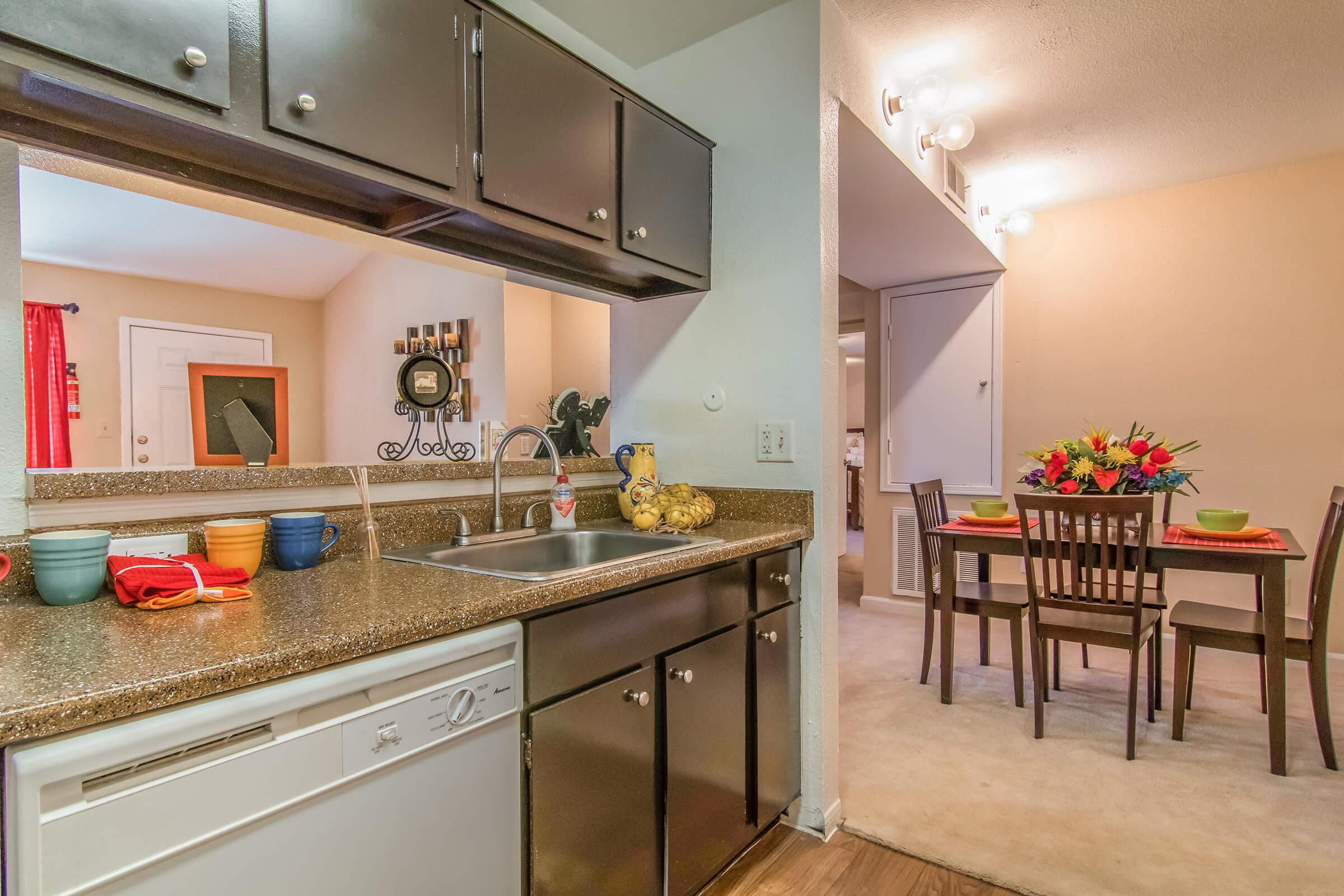 a kitchen with a dining room table