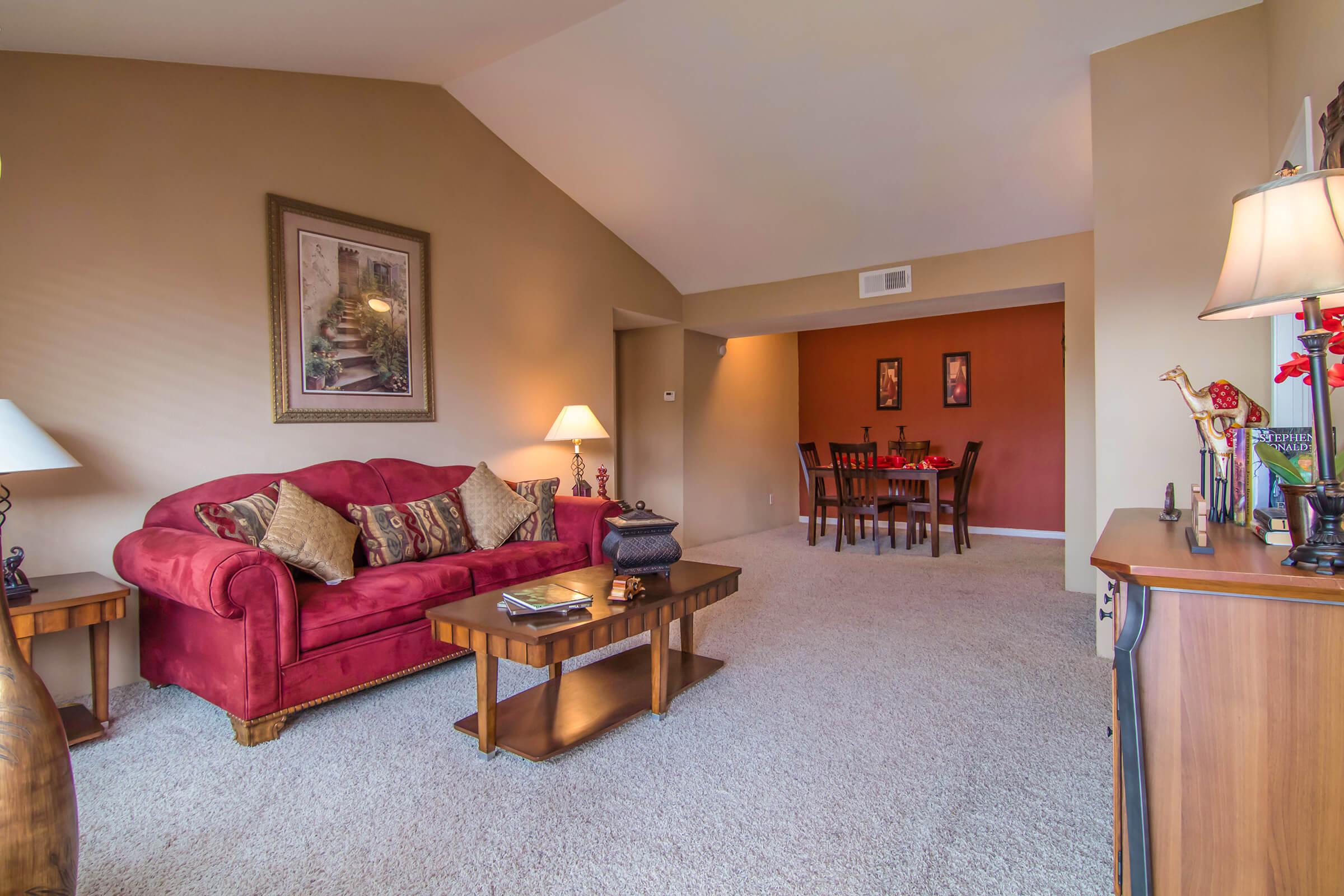 a living room filled with furniture and decor