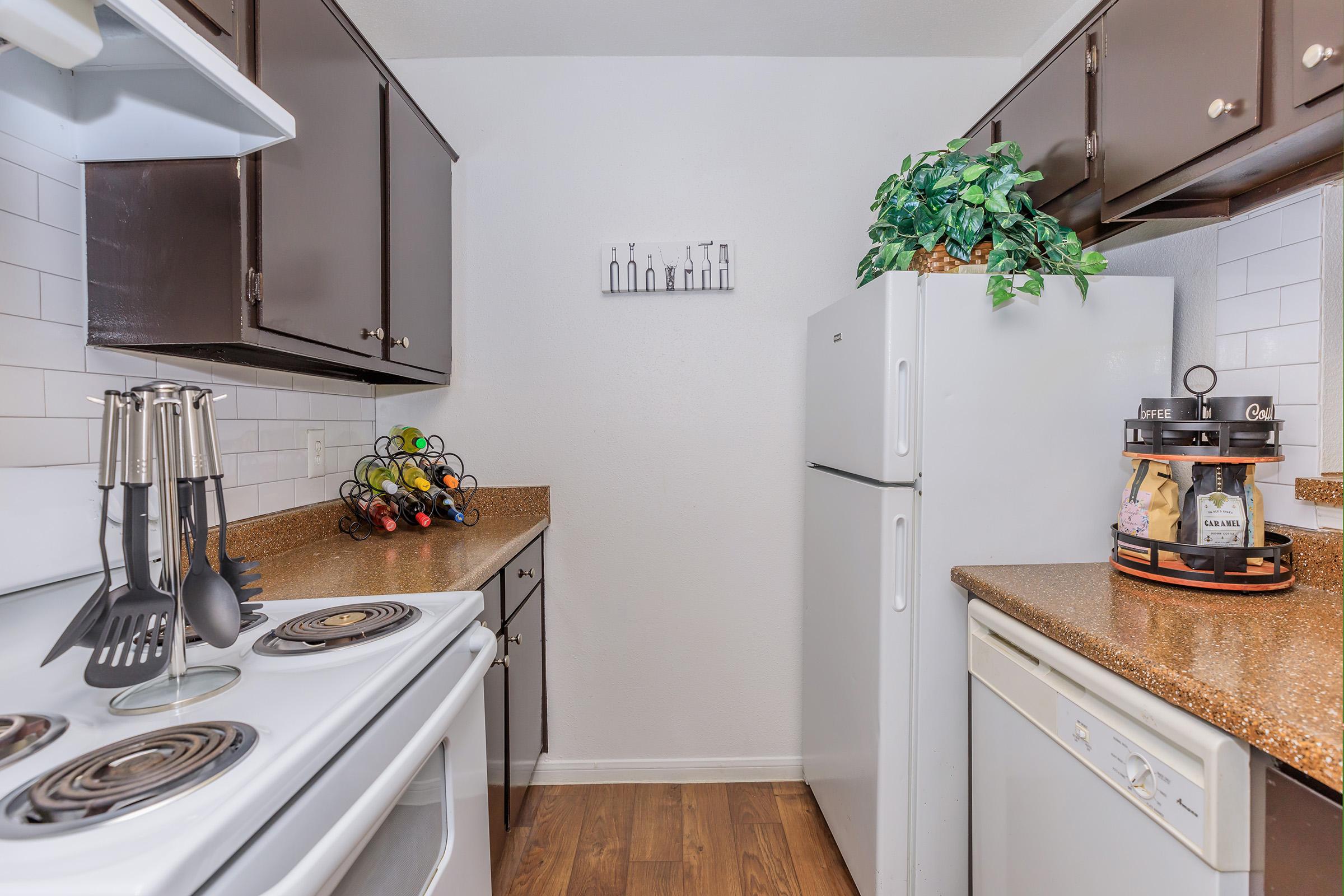 a stove top oven sitting inside of a kitchen