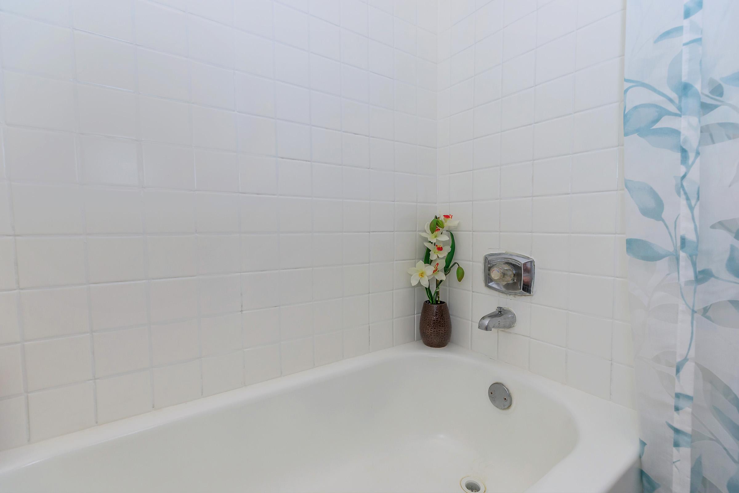 a close up of a sink and a bath tub