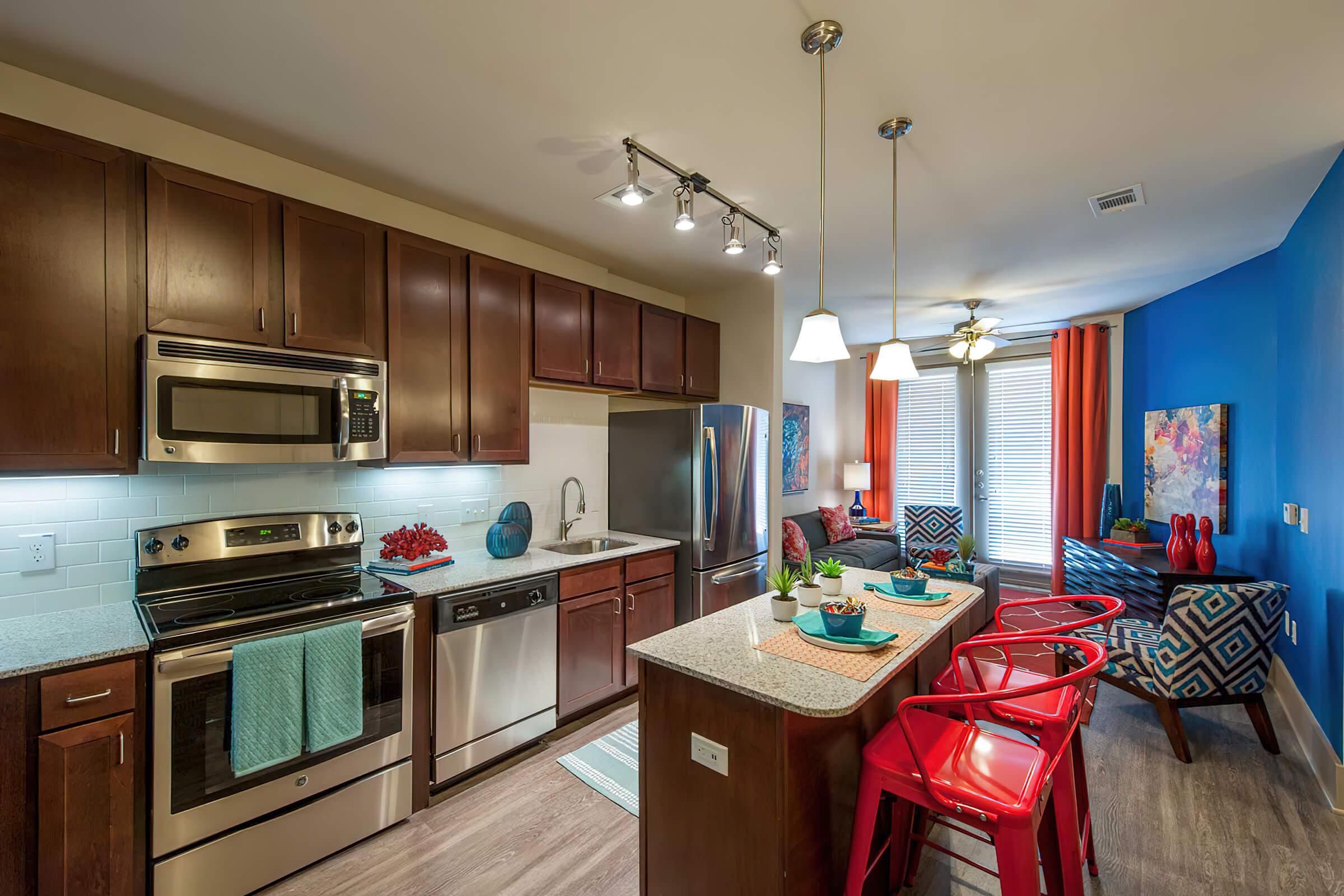 a modern kitchen with stainless steel appliances