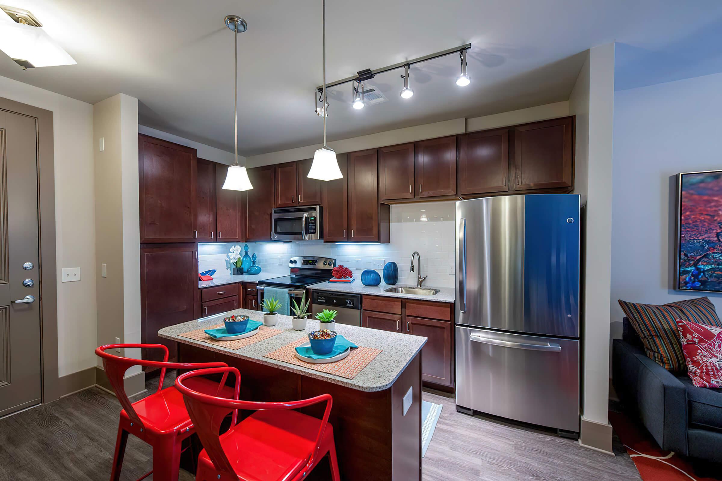 a kitchen with an island in the middle of a room