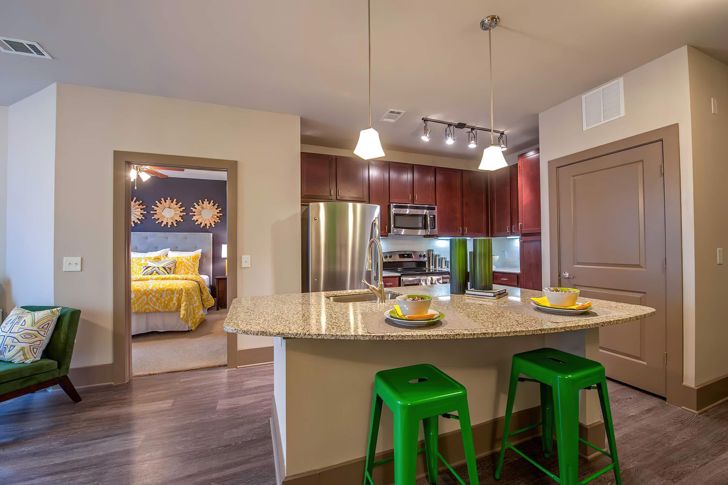 a kitchen with an island in the middle of a room