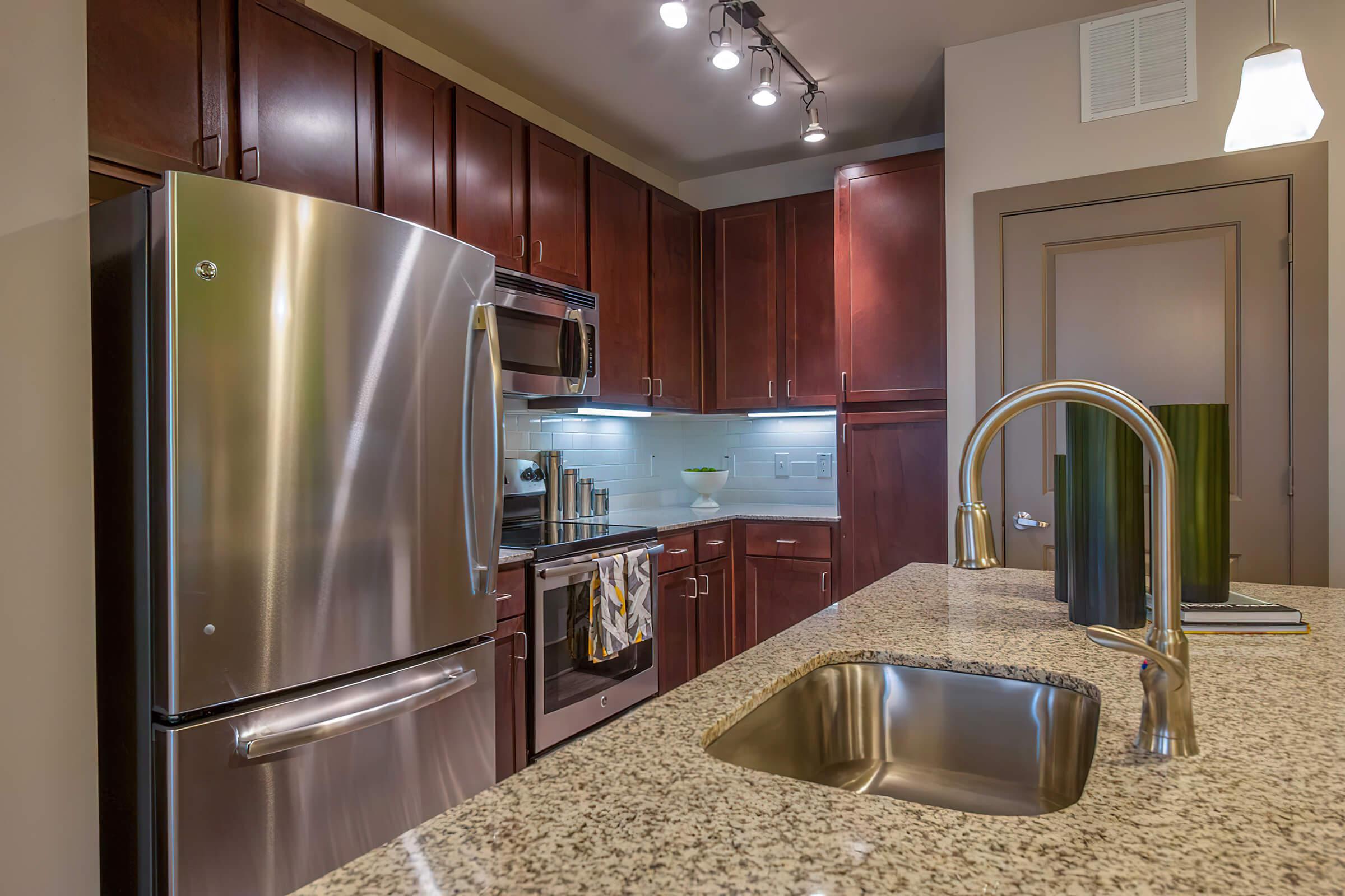 a modern kitchen with stainless steel appliances