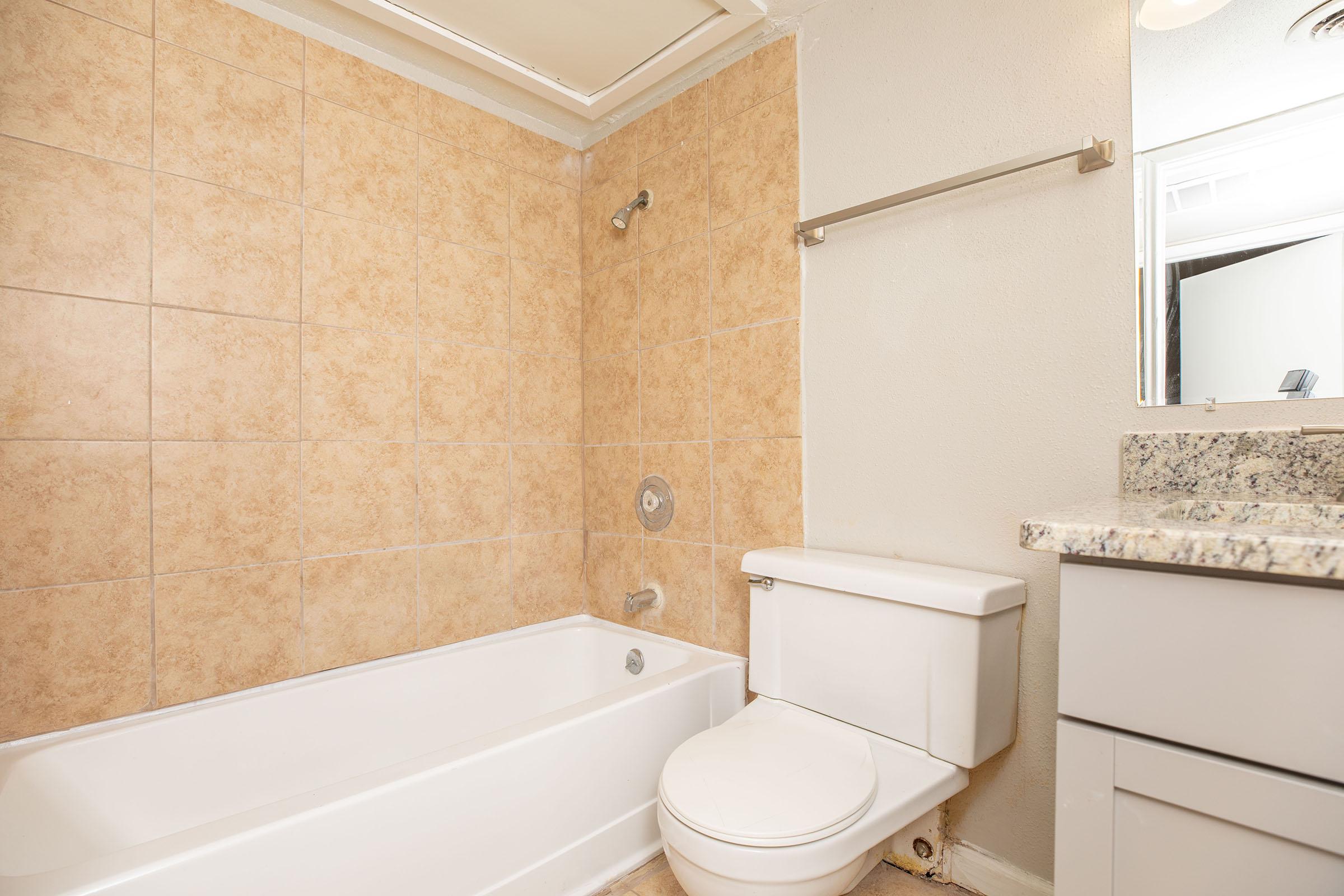 a close up of a sink and a bath tub