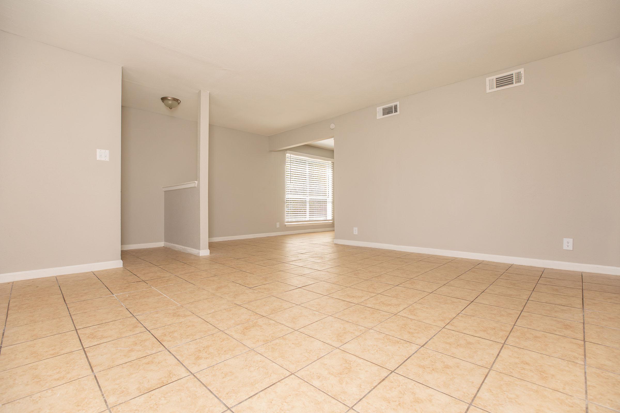 a kitchen with a tile floor