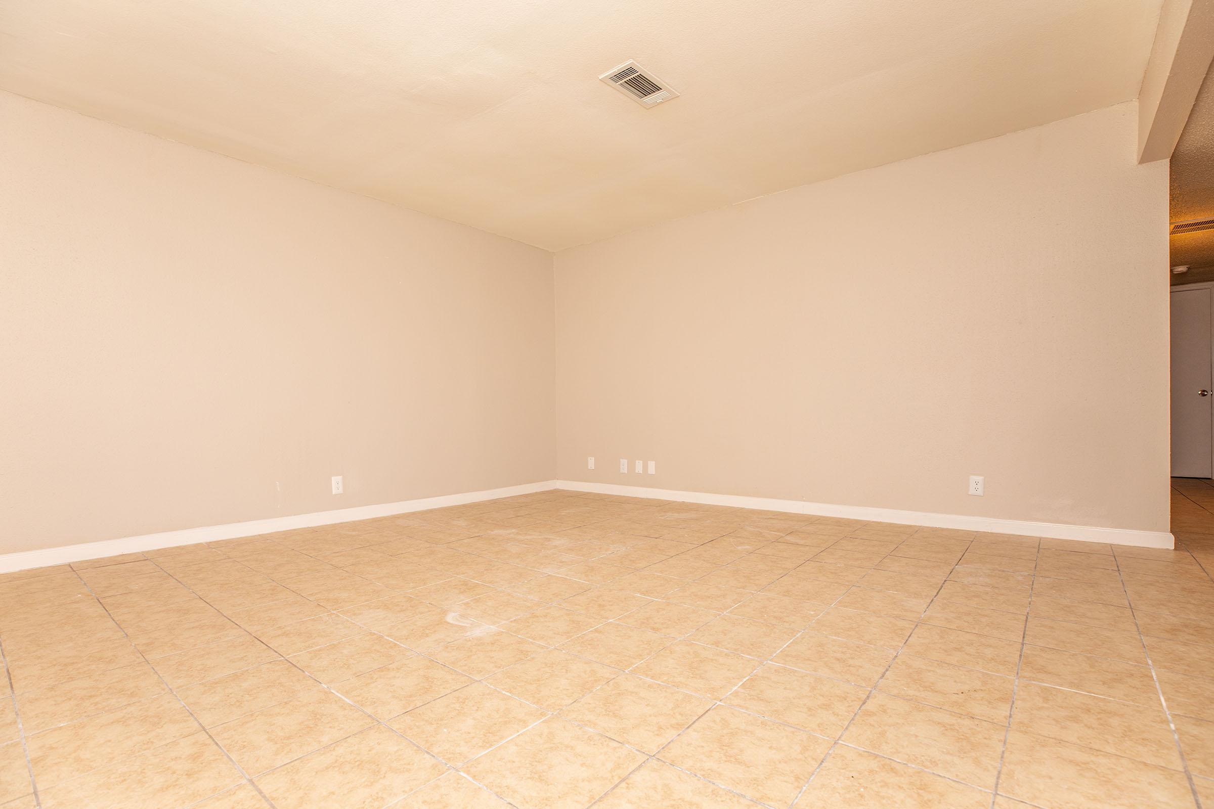 a kitchen with a tile floor