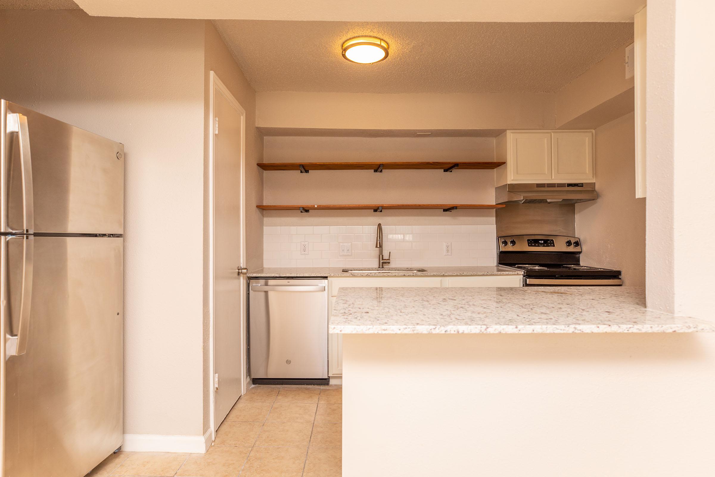 a stainless steel refrigerator in a kitchen