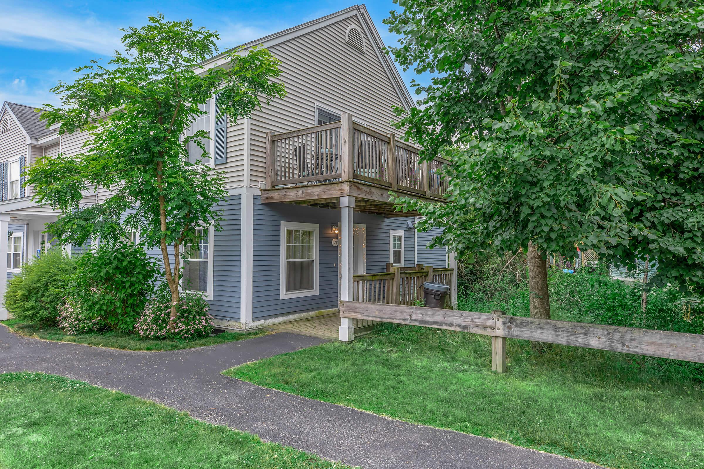 a tree in front of a house