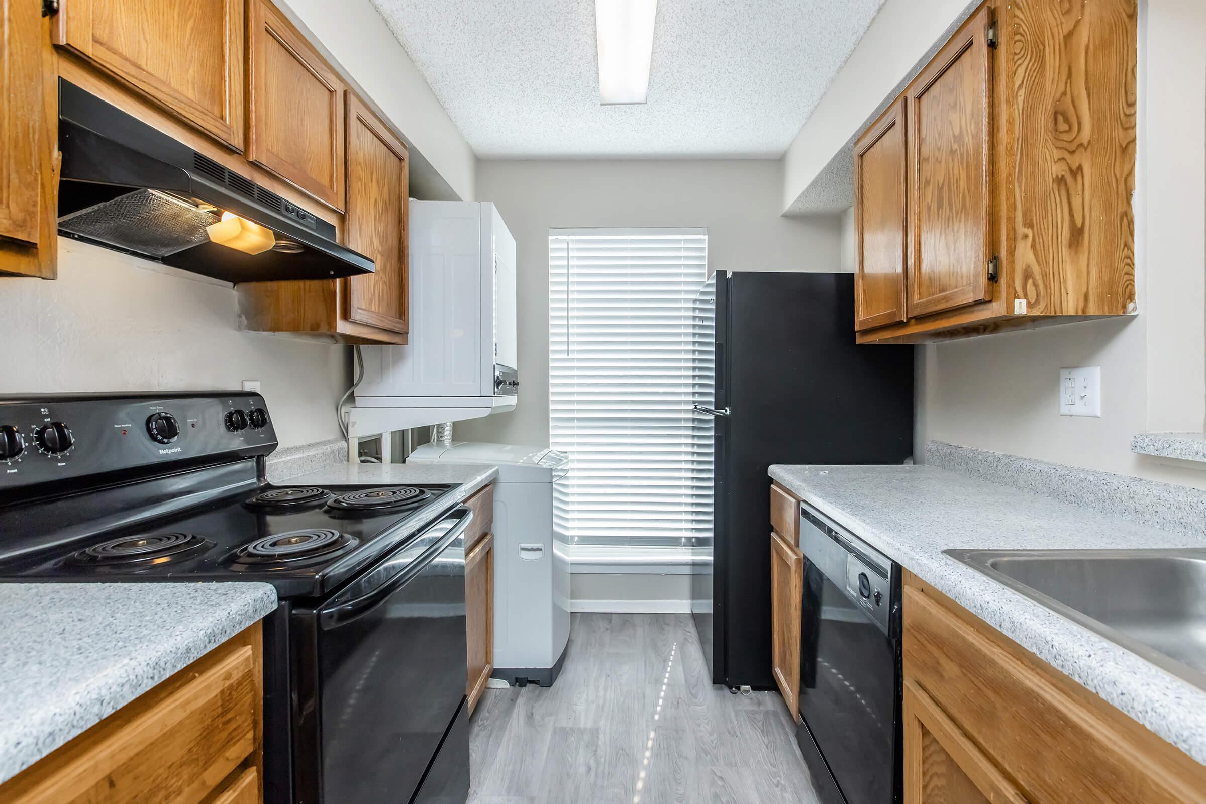 a kitchen with a stove top oven