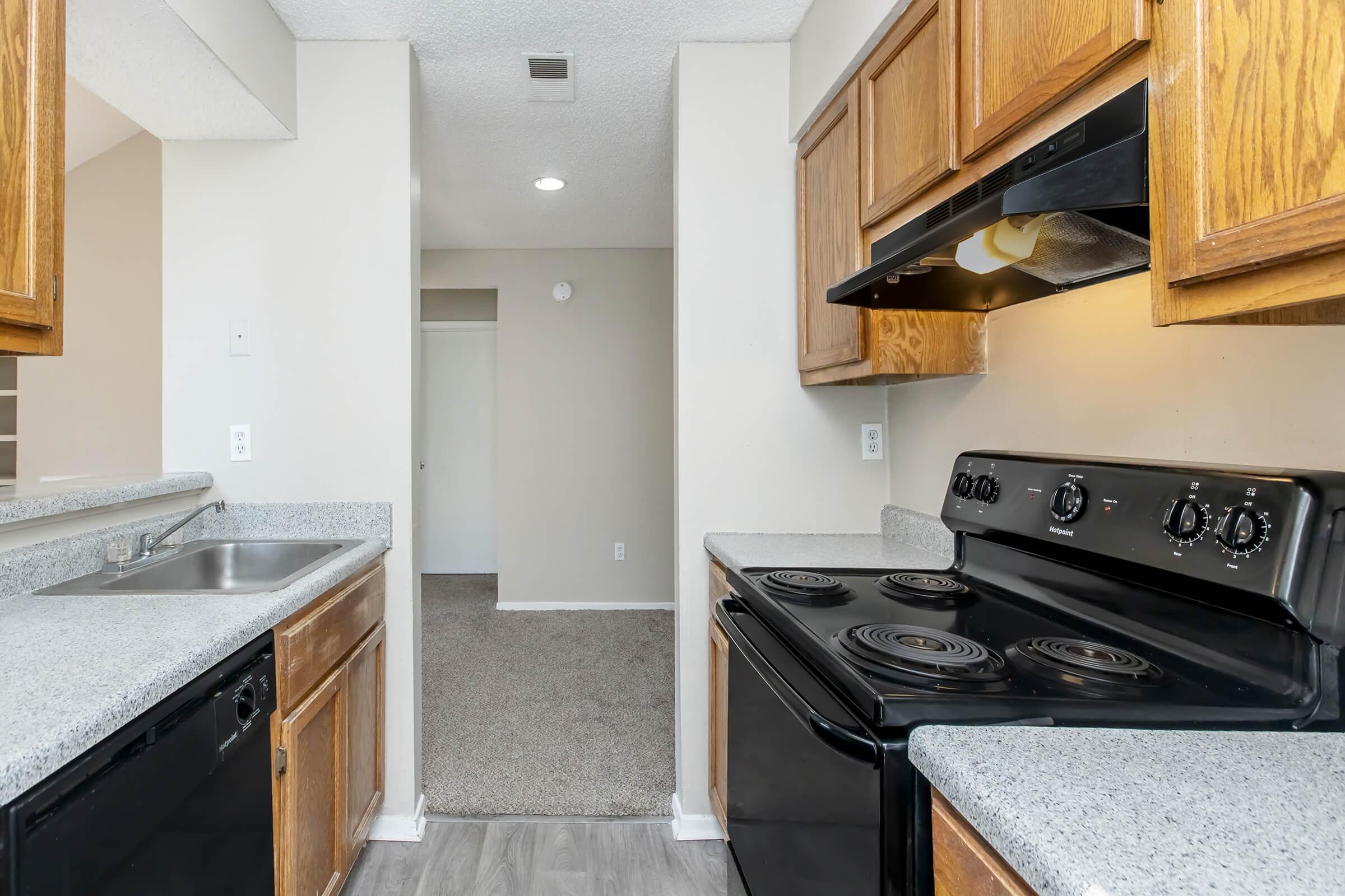 a kitchen with a stove top oven