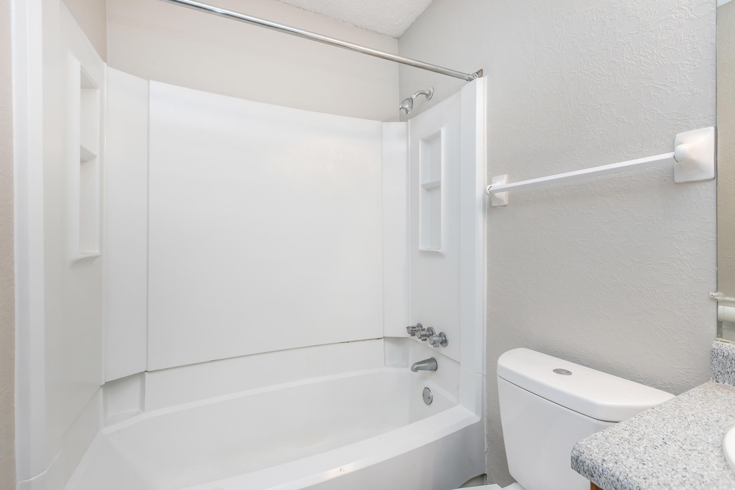 a close up of a sink and a shower