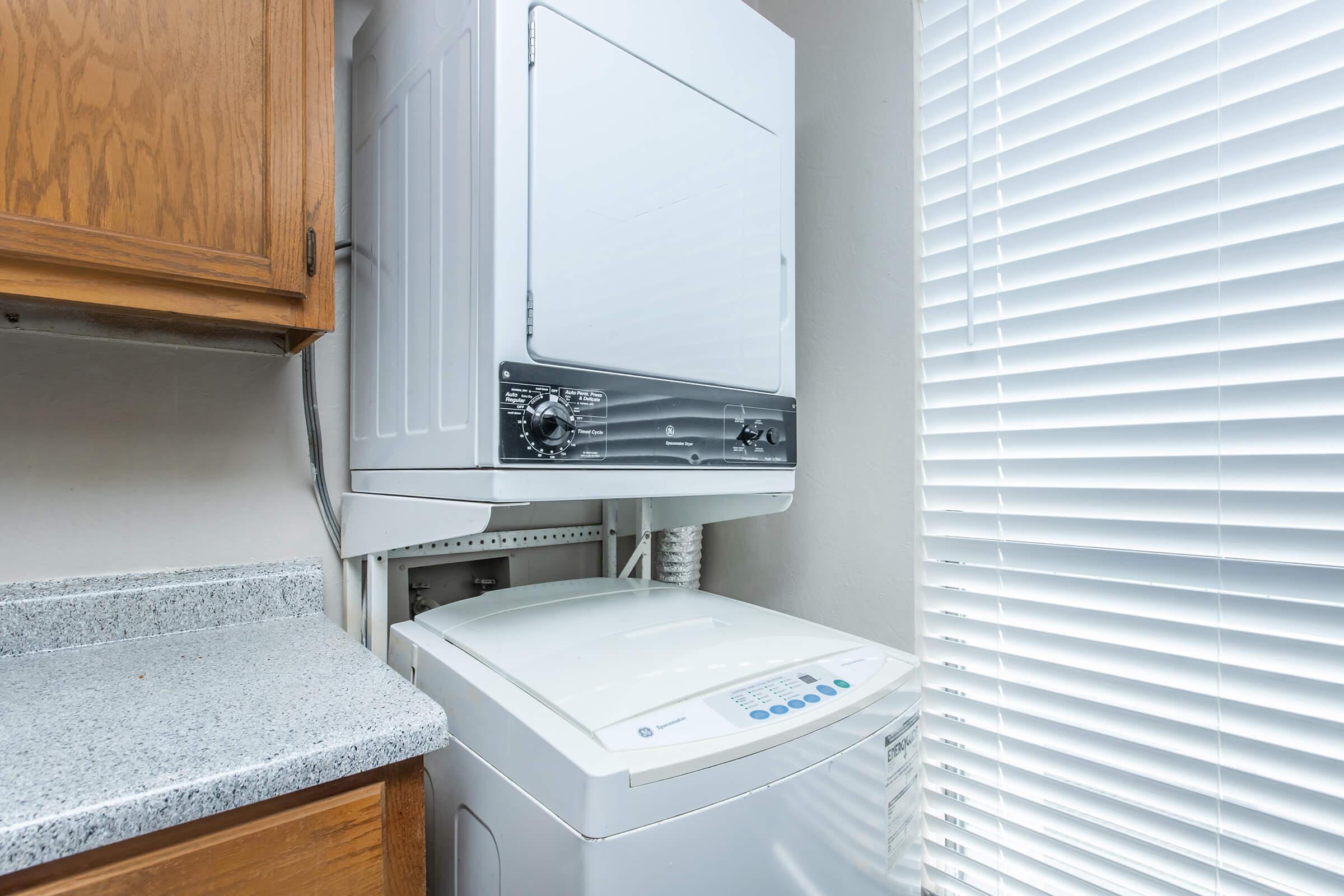 a stove top oven sitting next to a window