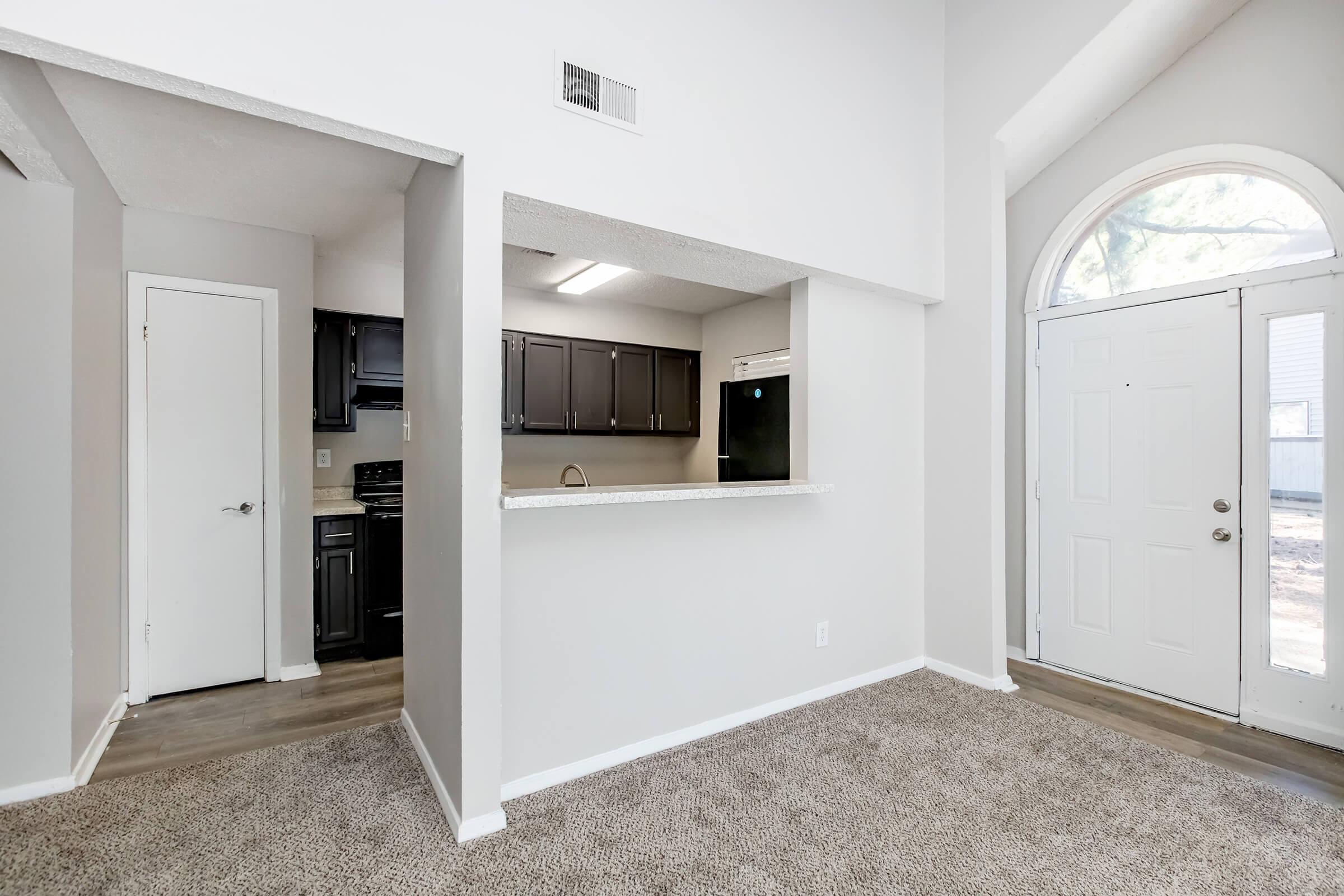 a kitchen area with a building in the background