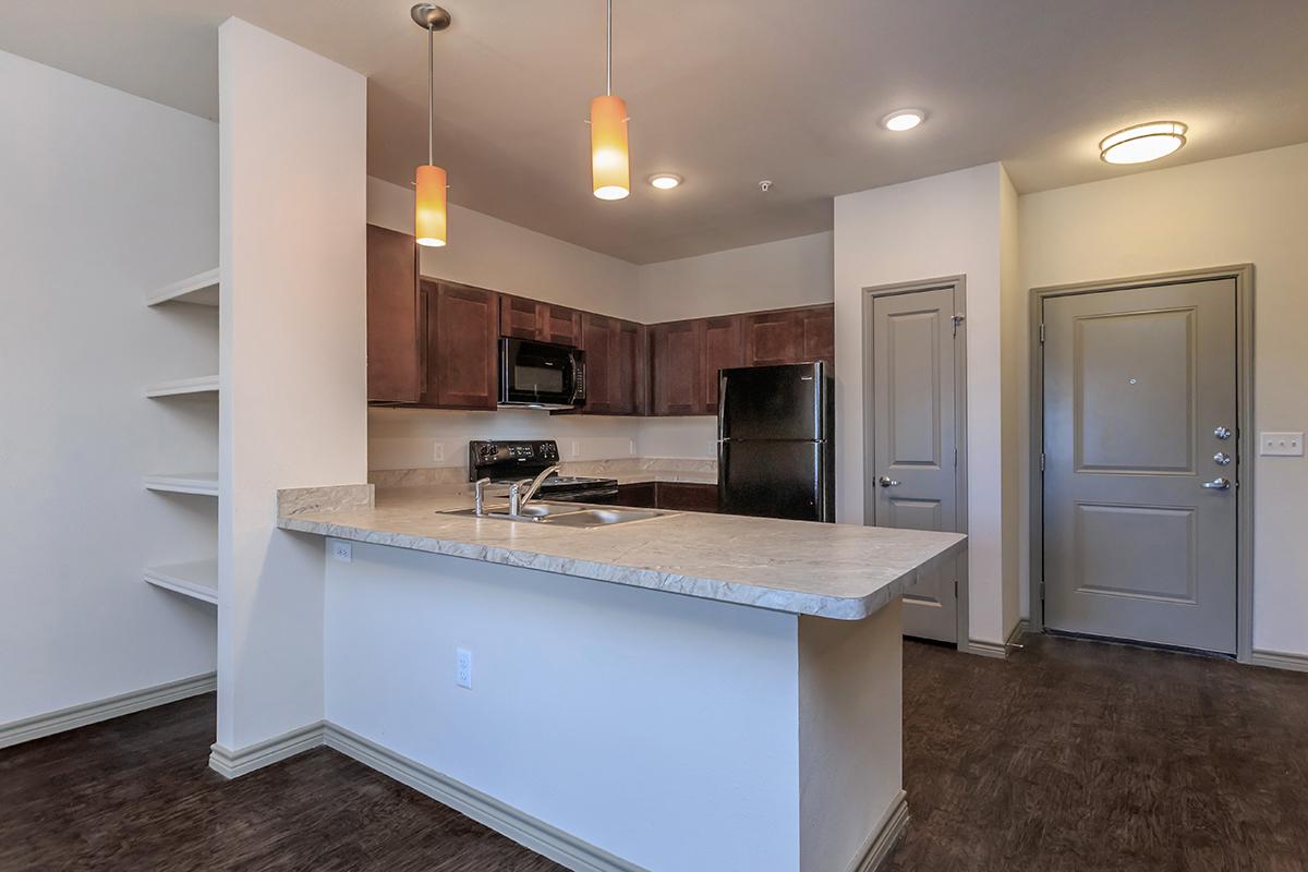 a kitchen with a sink and a refrigerator