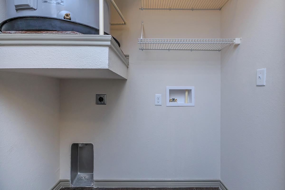 a kitchen with a sink and a mirror