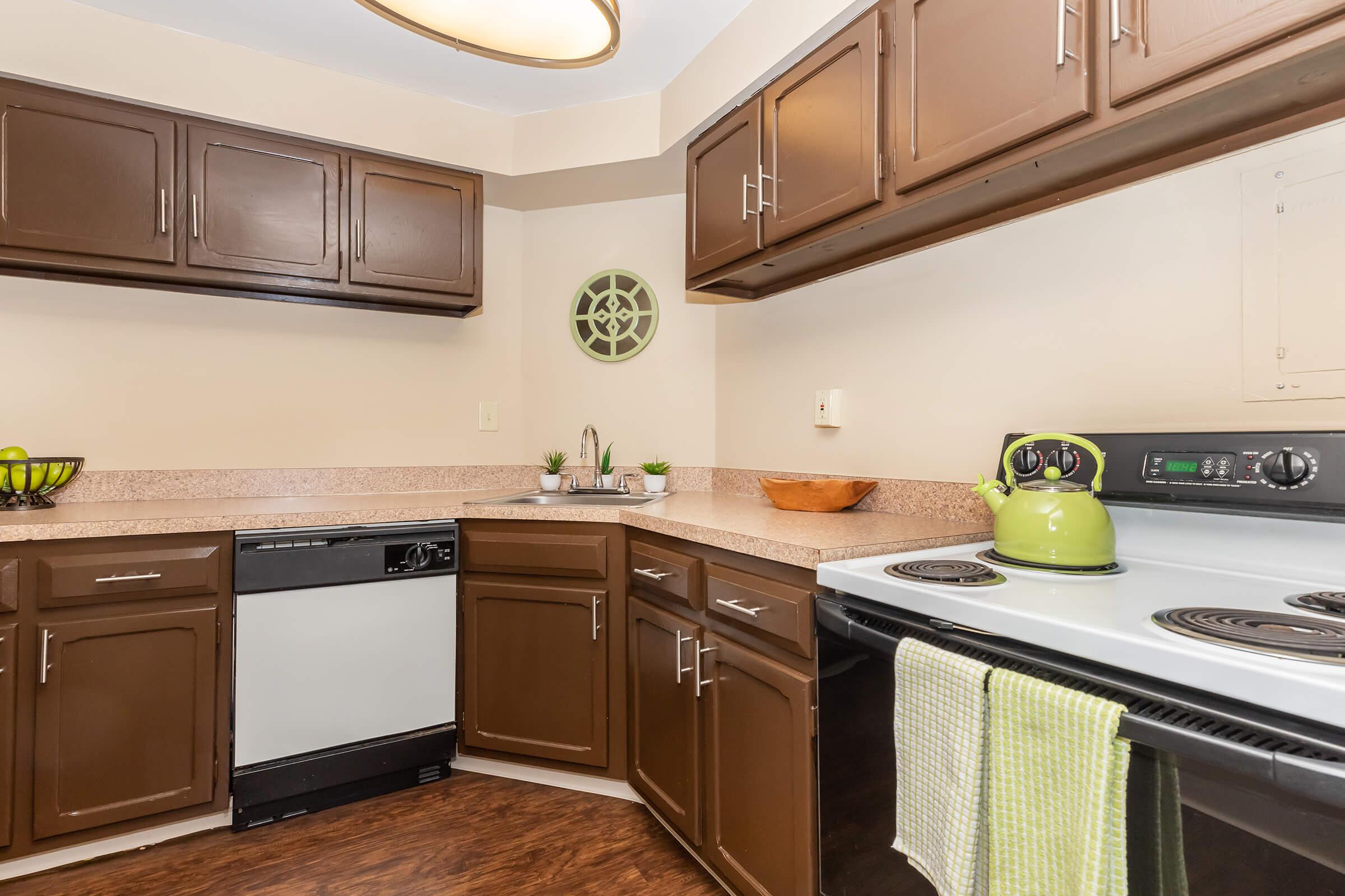a kitchen with a stove a sink and a microwave