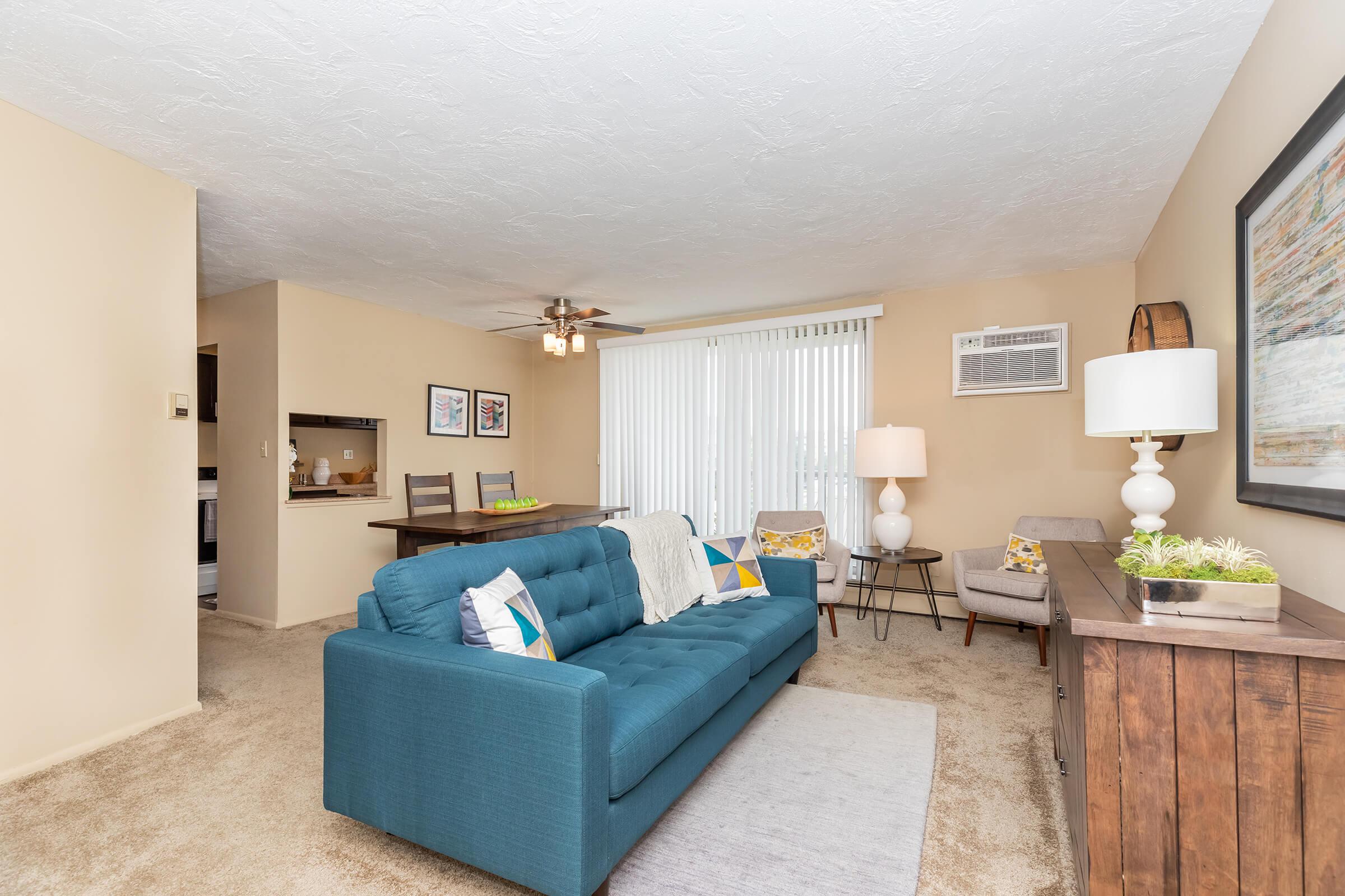 a living room filled with furniture and a tv