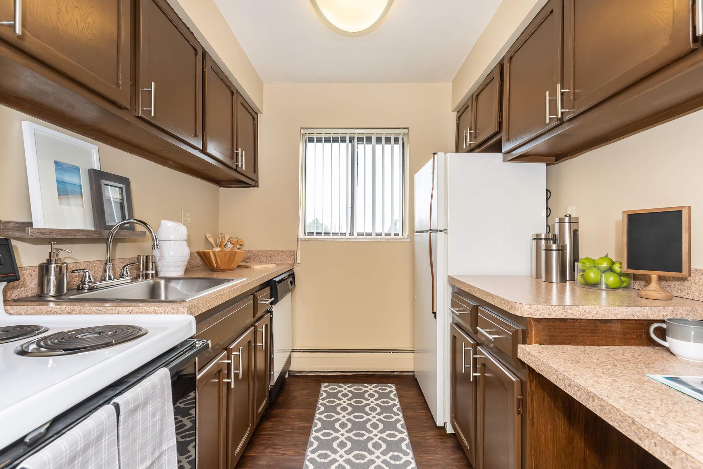 a kitchen with a sink and a window