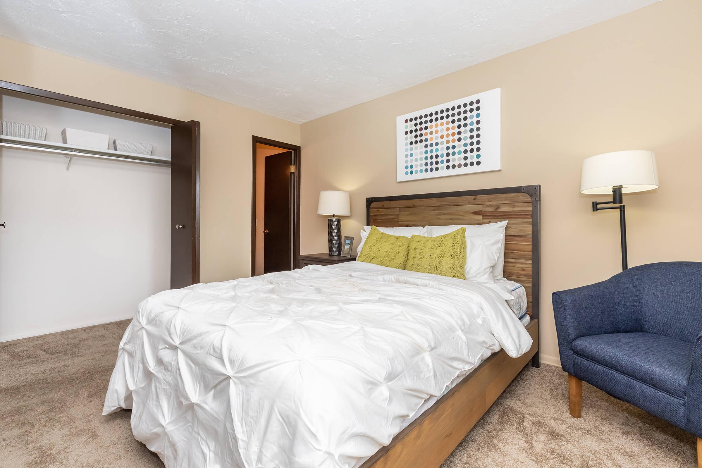 a bedroom with a bed in a hotel room