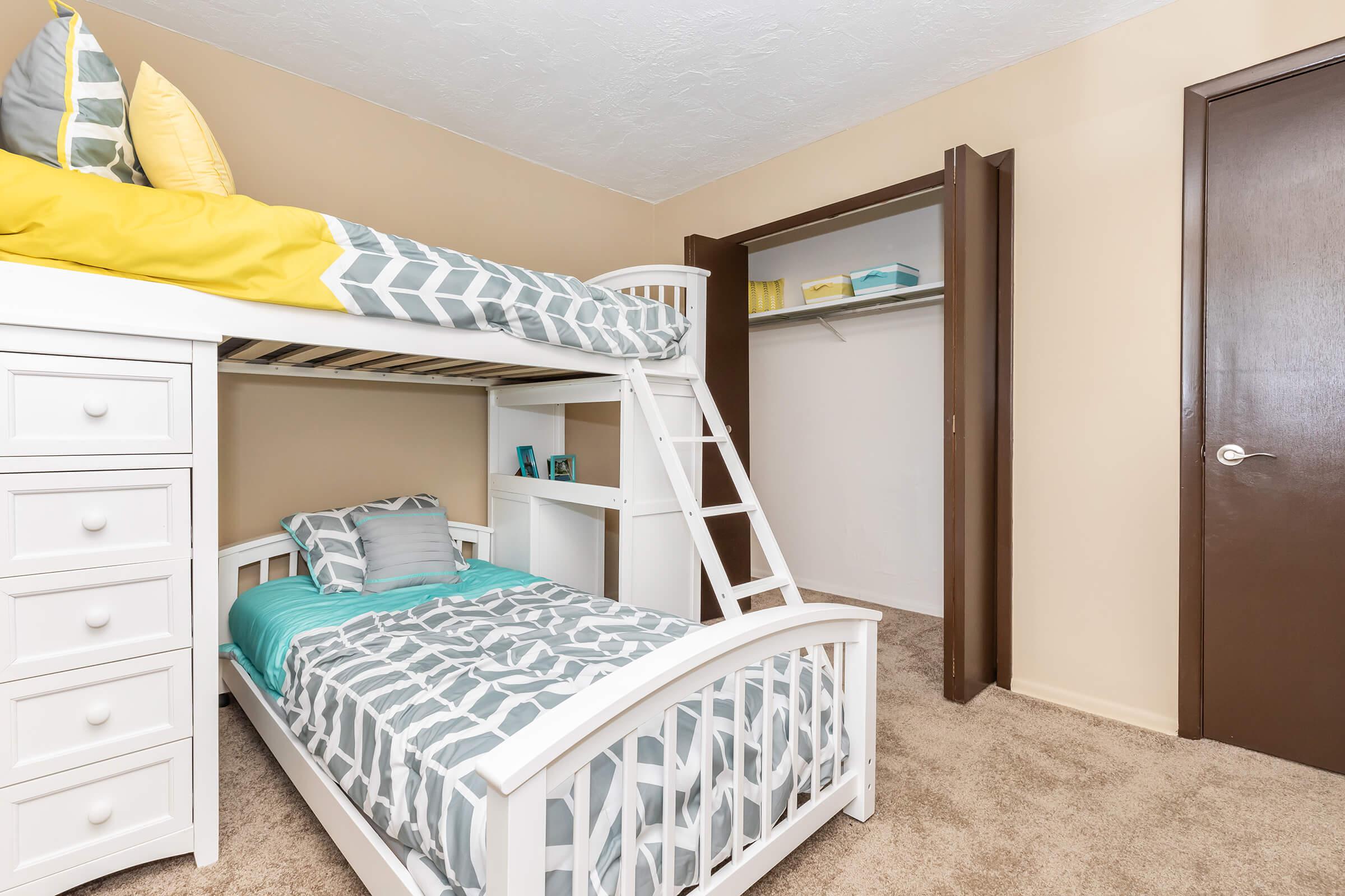 a bedroom with a bed in a room