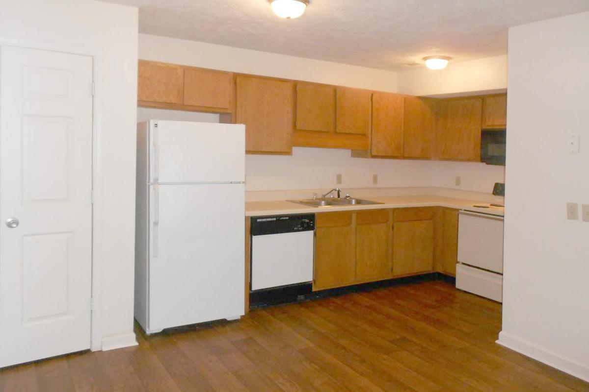 a kitchen with a wood floor