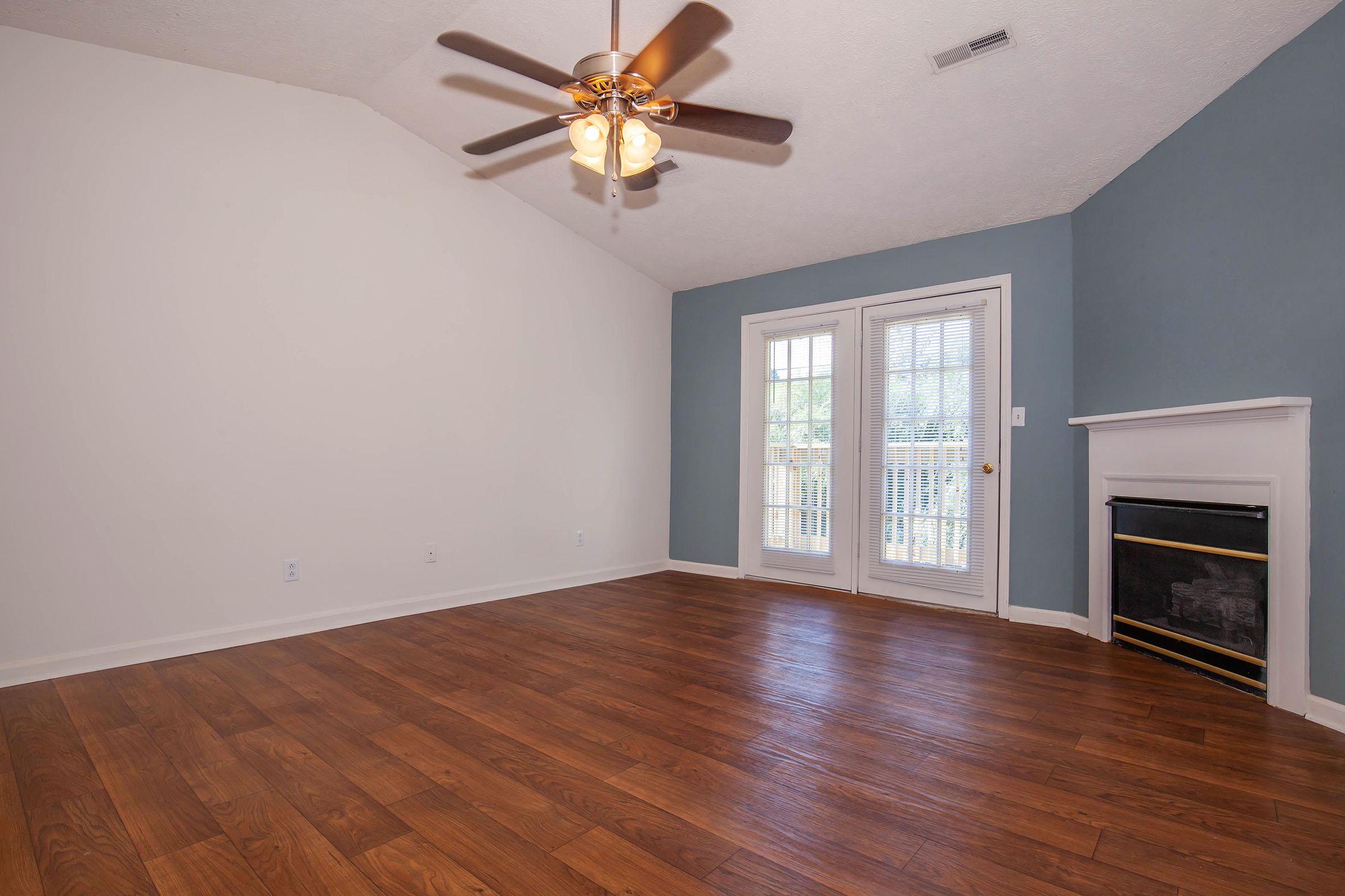 a view of a living room with a wood floor
