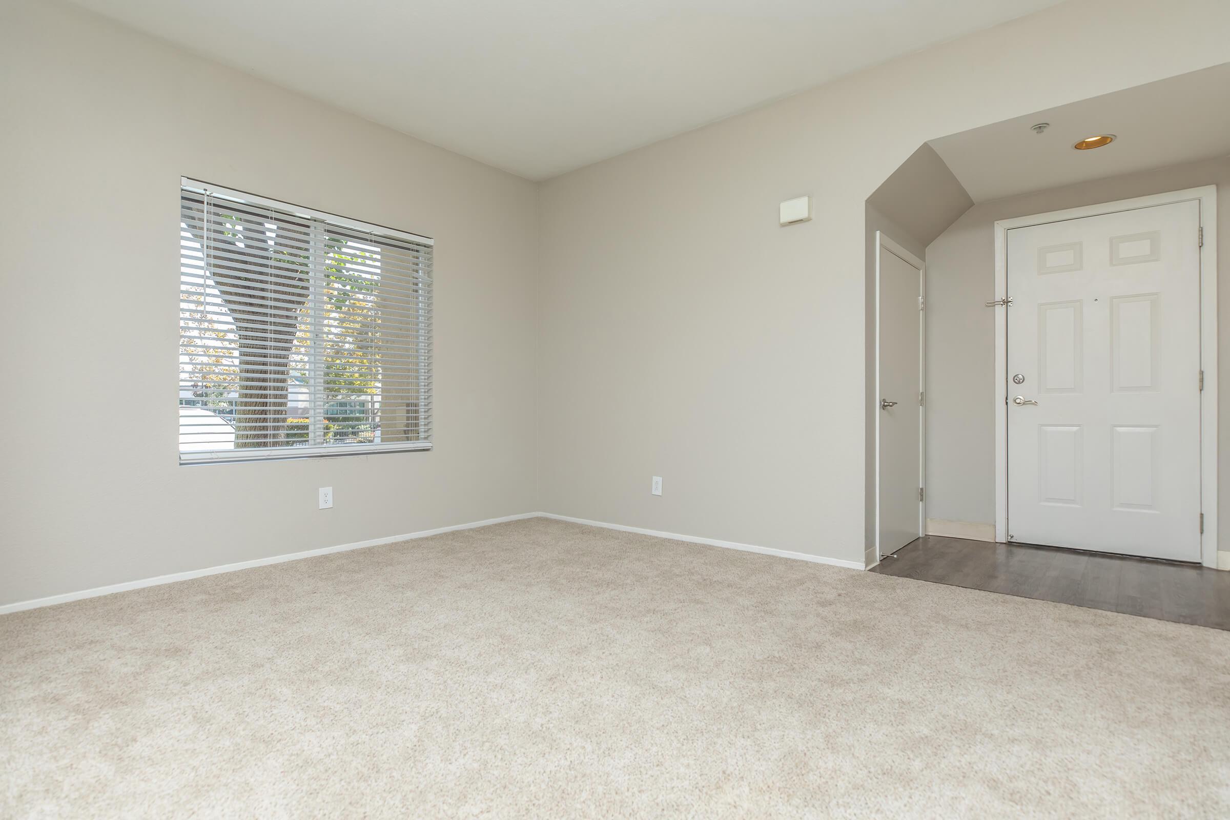 a bedroom with a large window