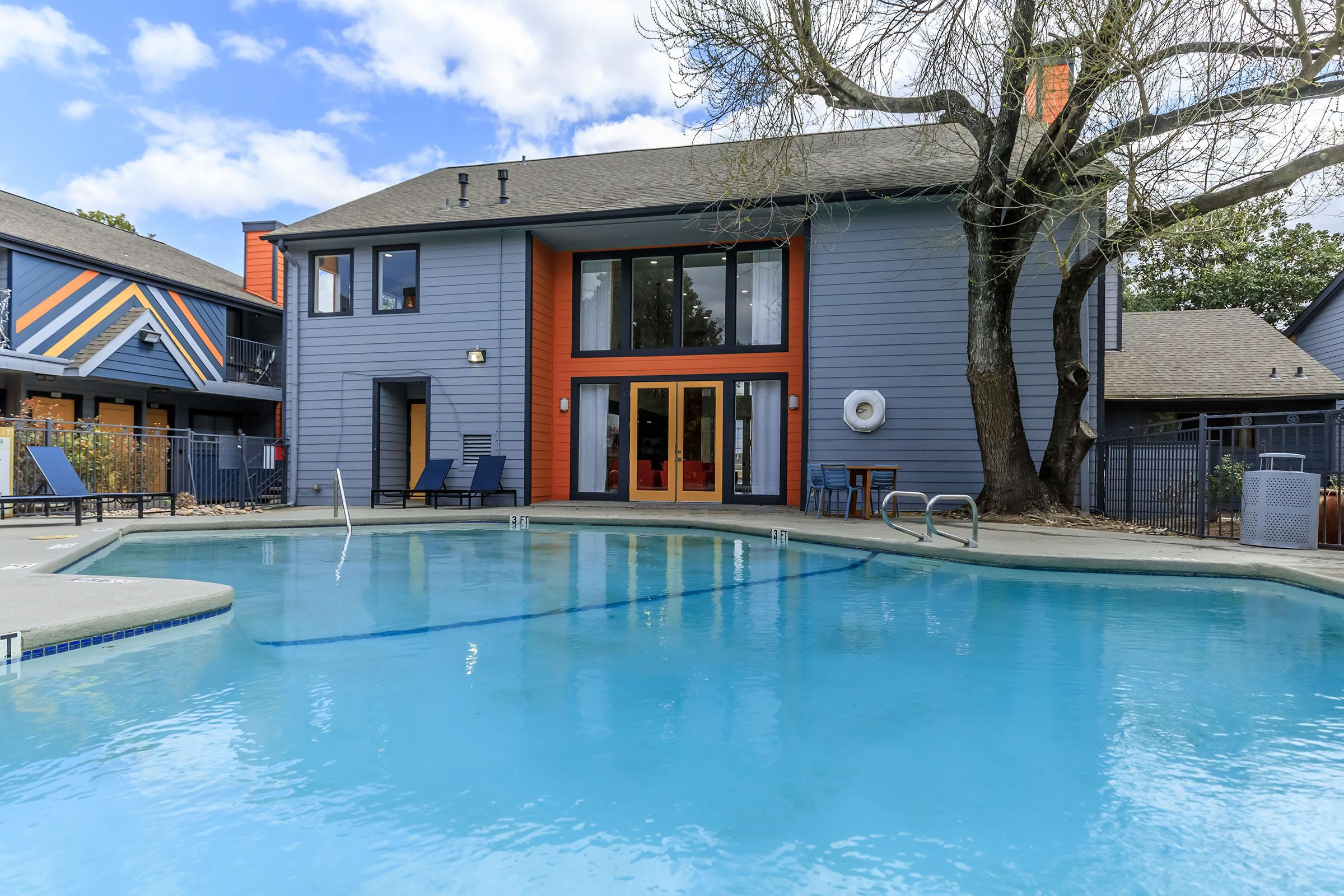 SOAK UP THE SUN BY THE SHIMMERING SWIMMING POOL