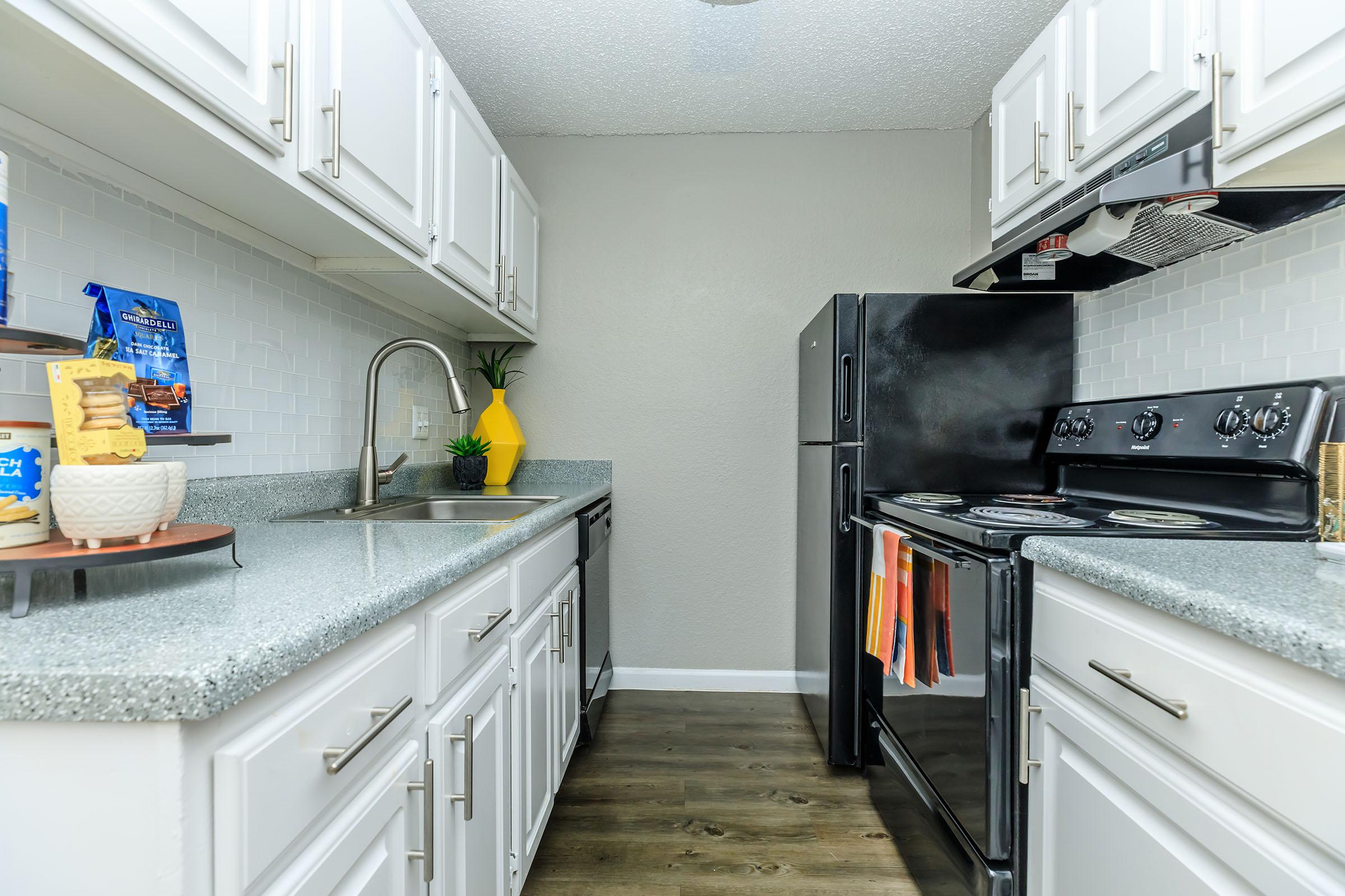 a large kitchen with stainless steel appliances