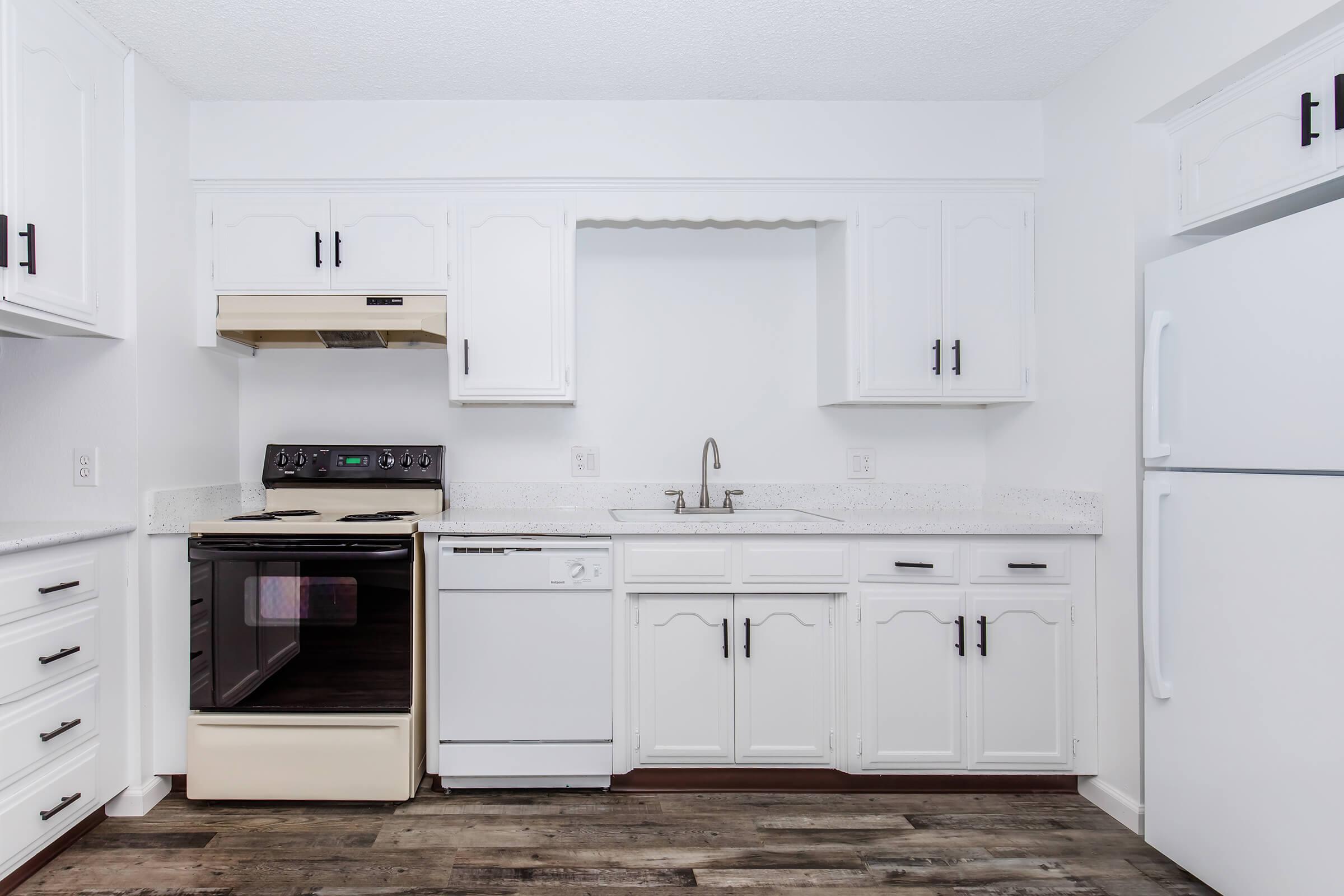 a kitchen with a stove top oven sitting inside of a refrigerator