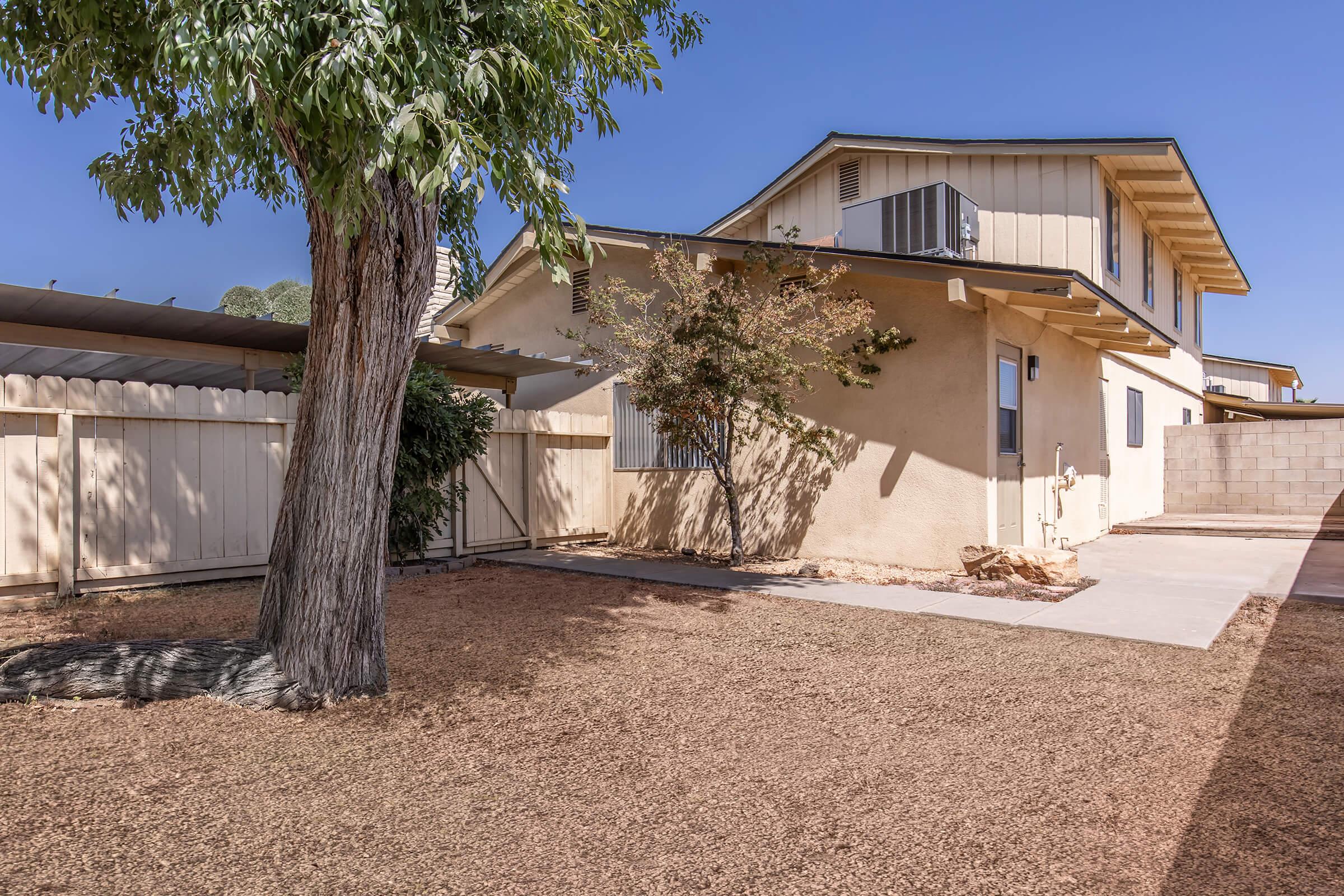 a house with trees in the background