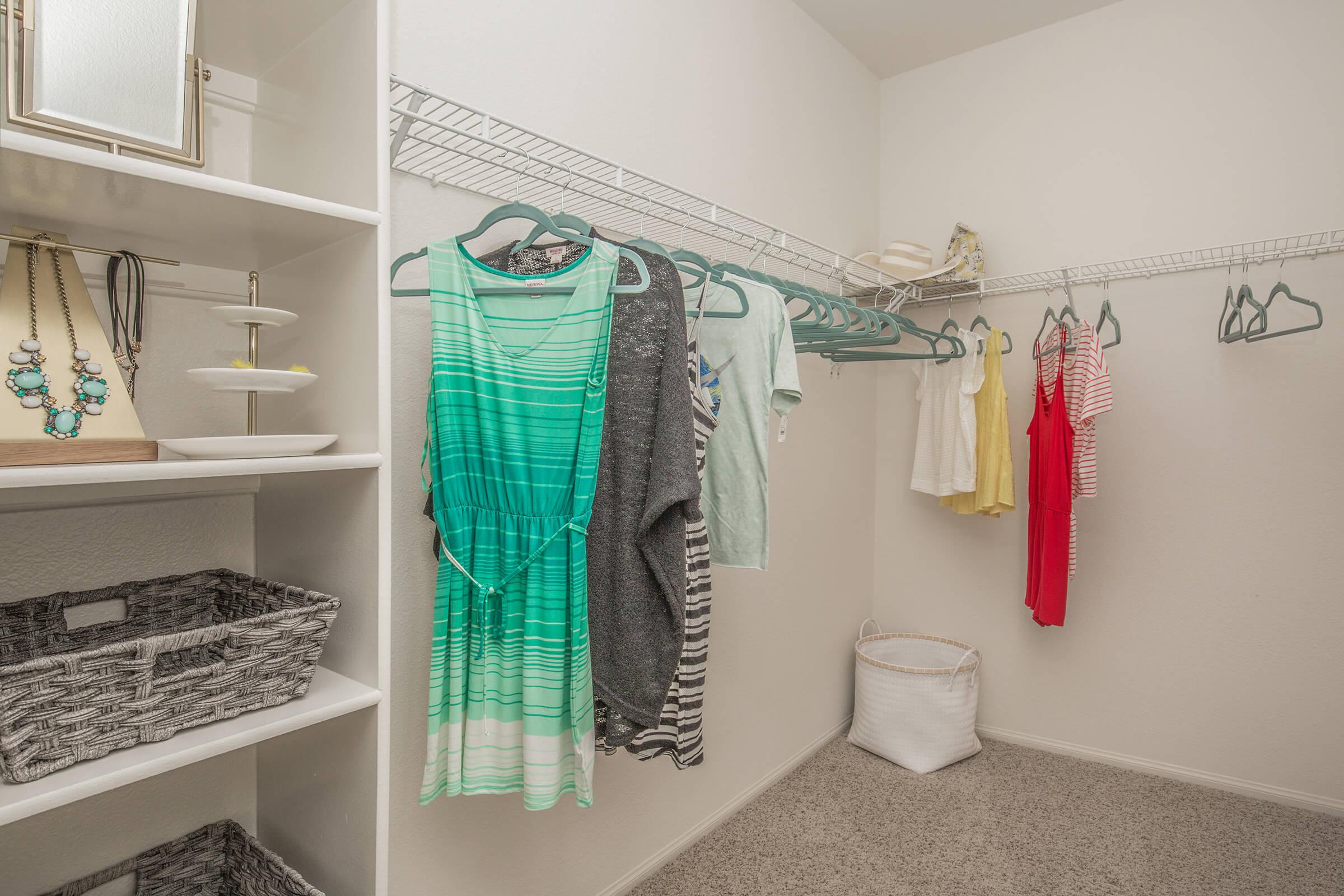 Walk-in closet with clothes
