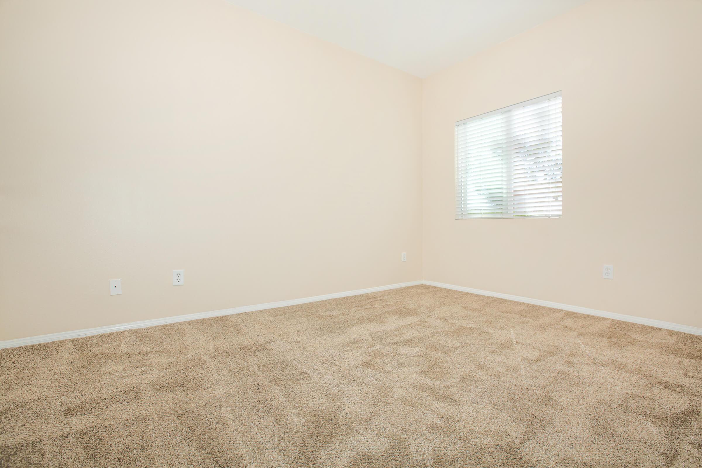 a bedroom with a large window