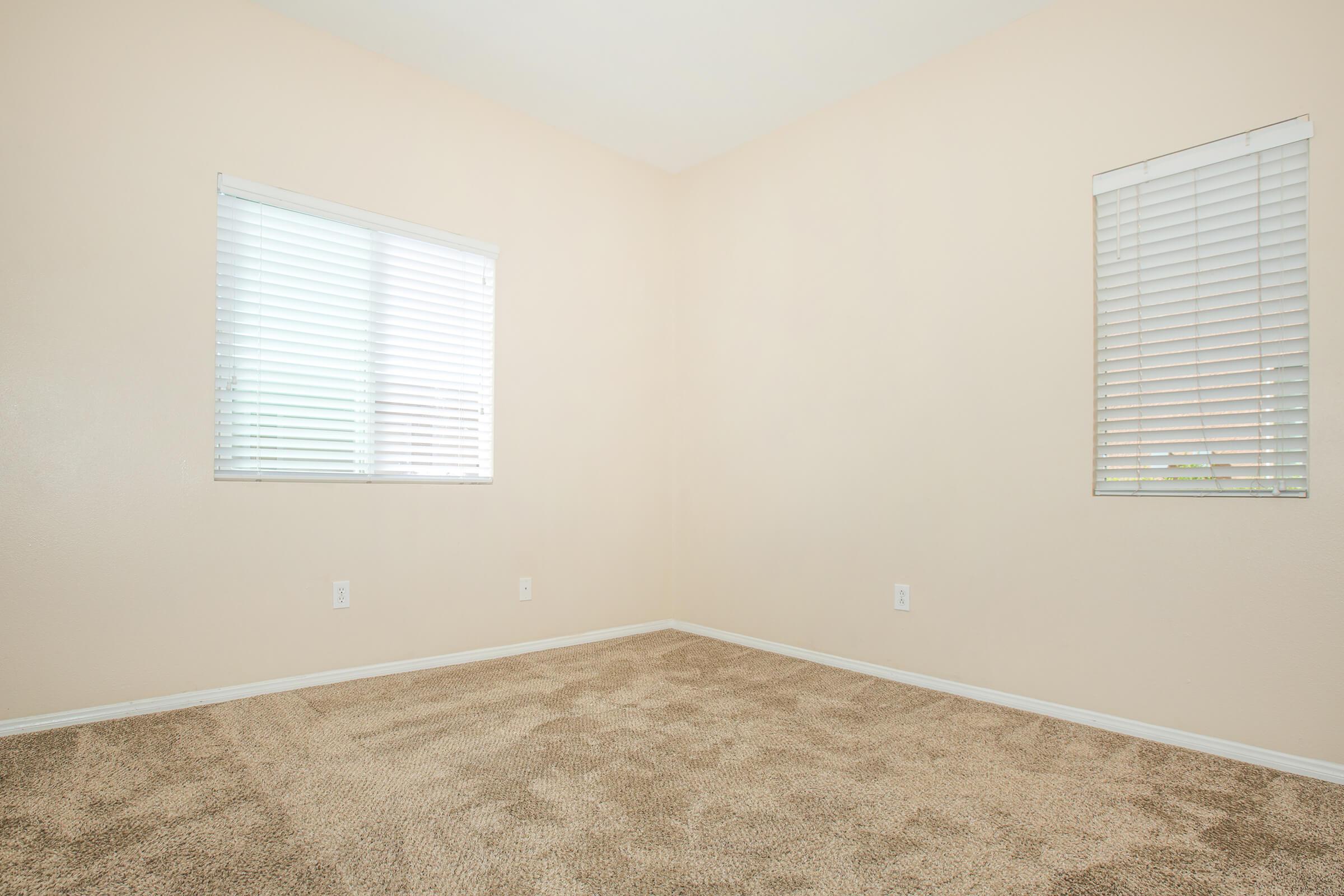 a bedroom with a large window