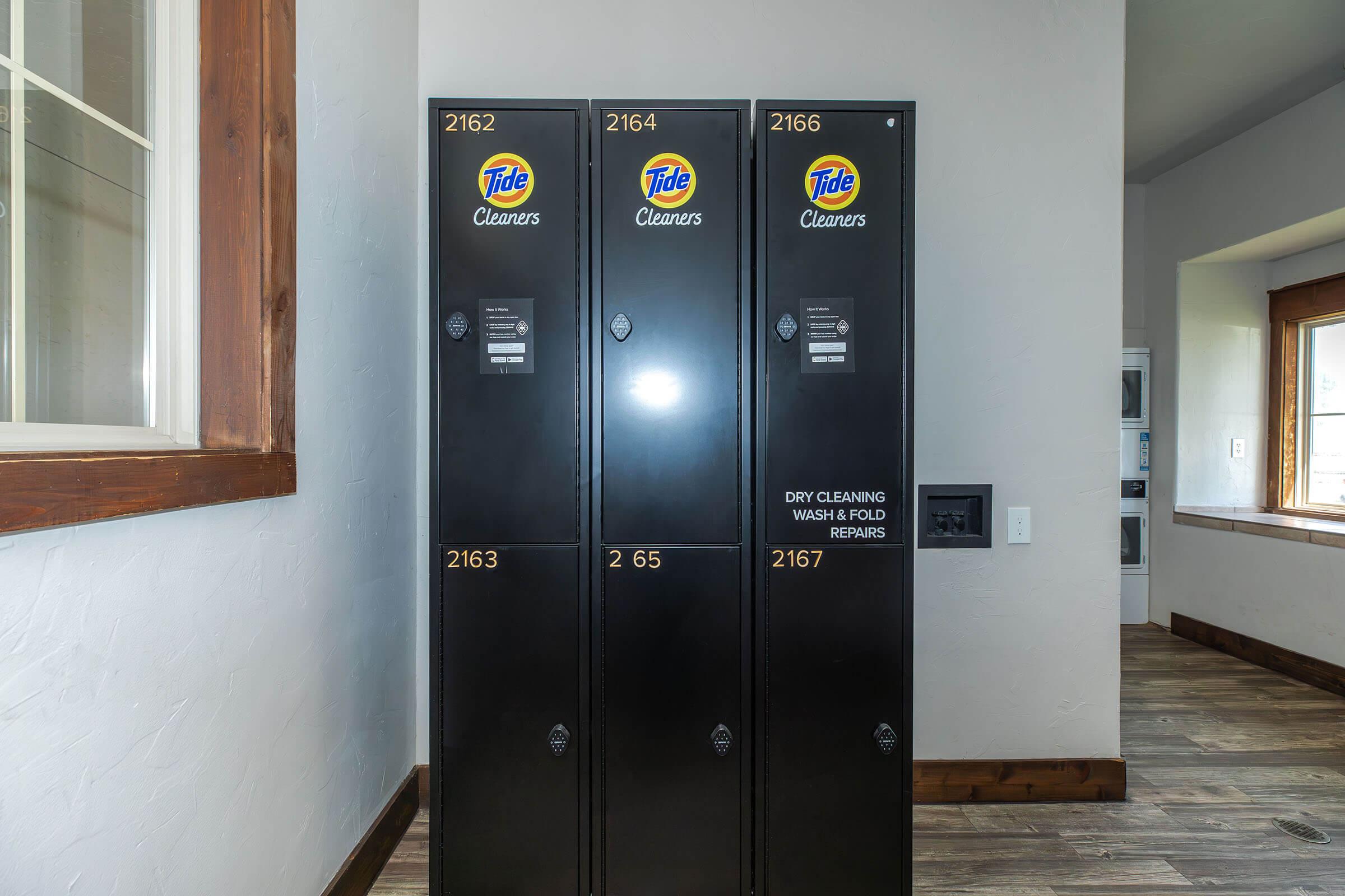 a double door refrigerator in the corner of a room