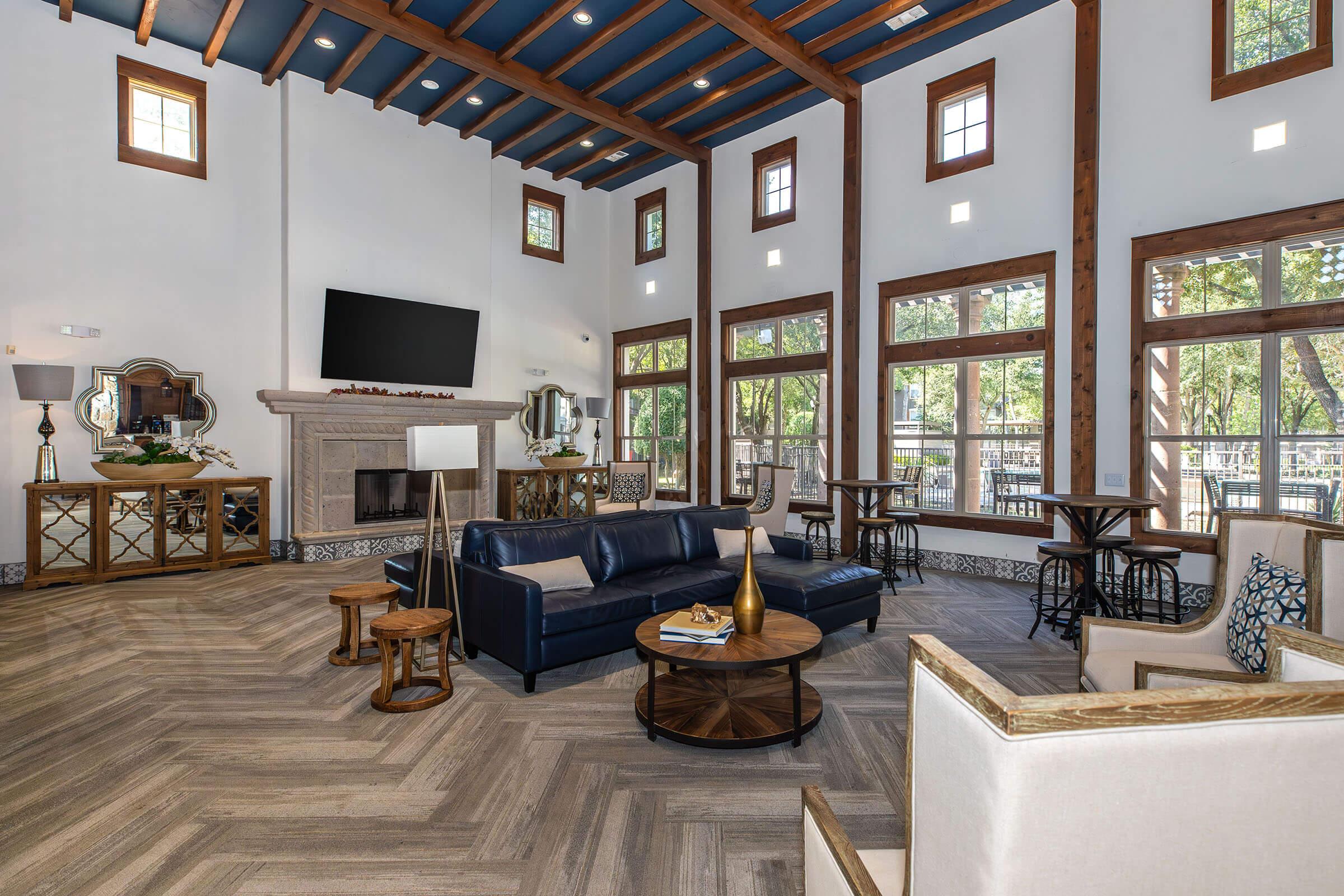 a living room filled with furniture and a fireplace