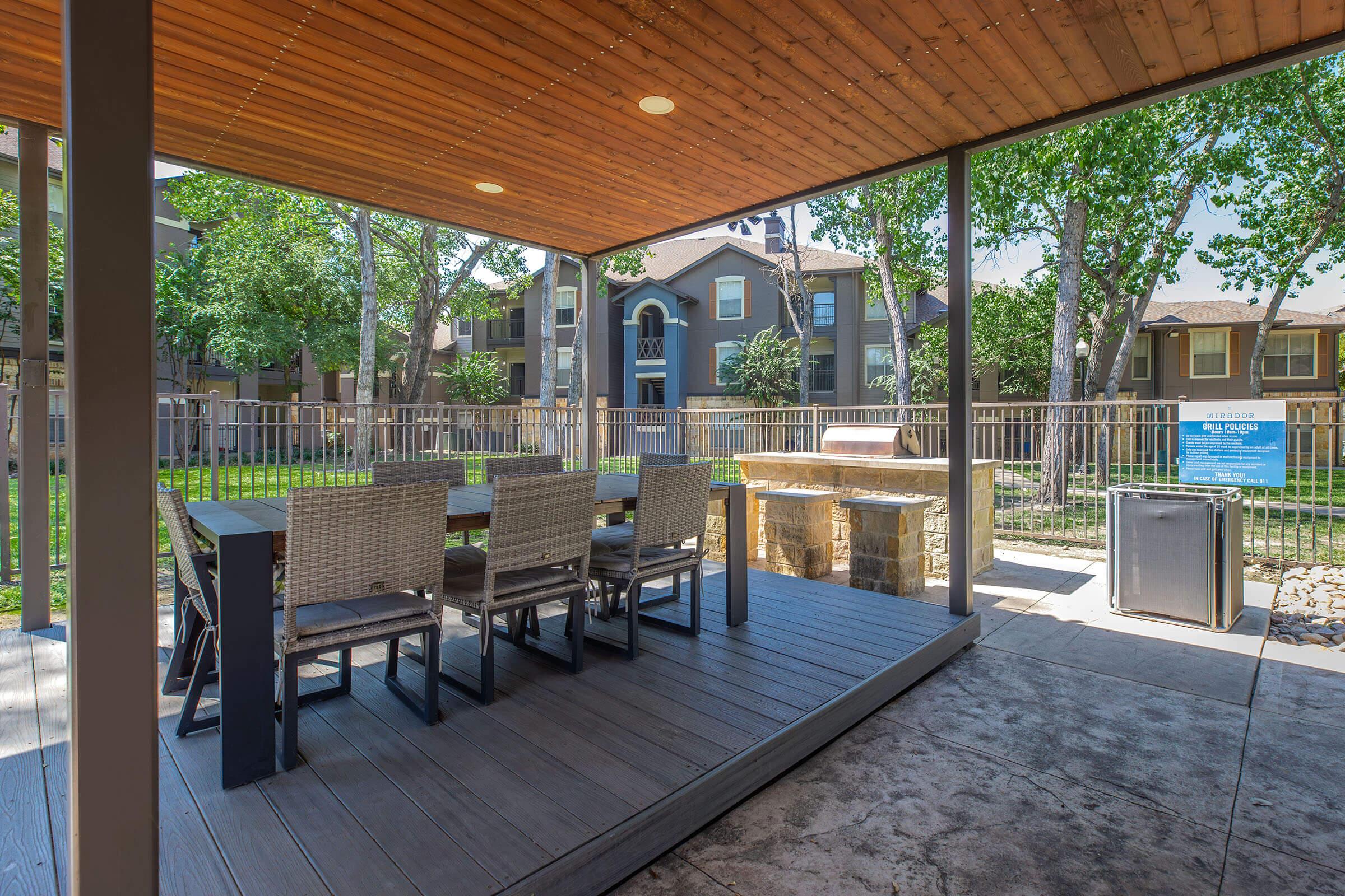 a wooden bench in front of a building