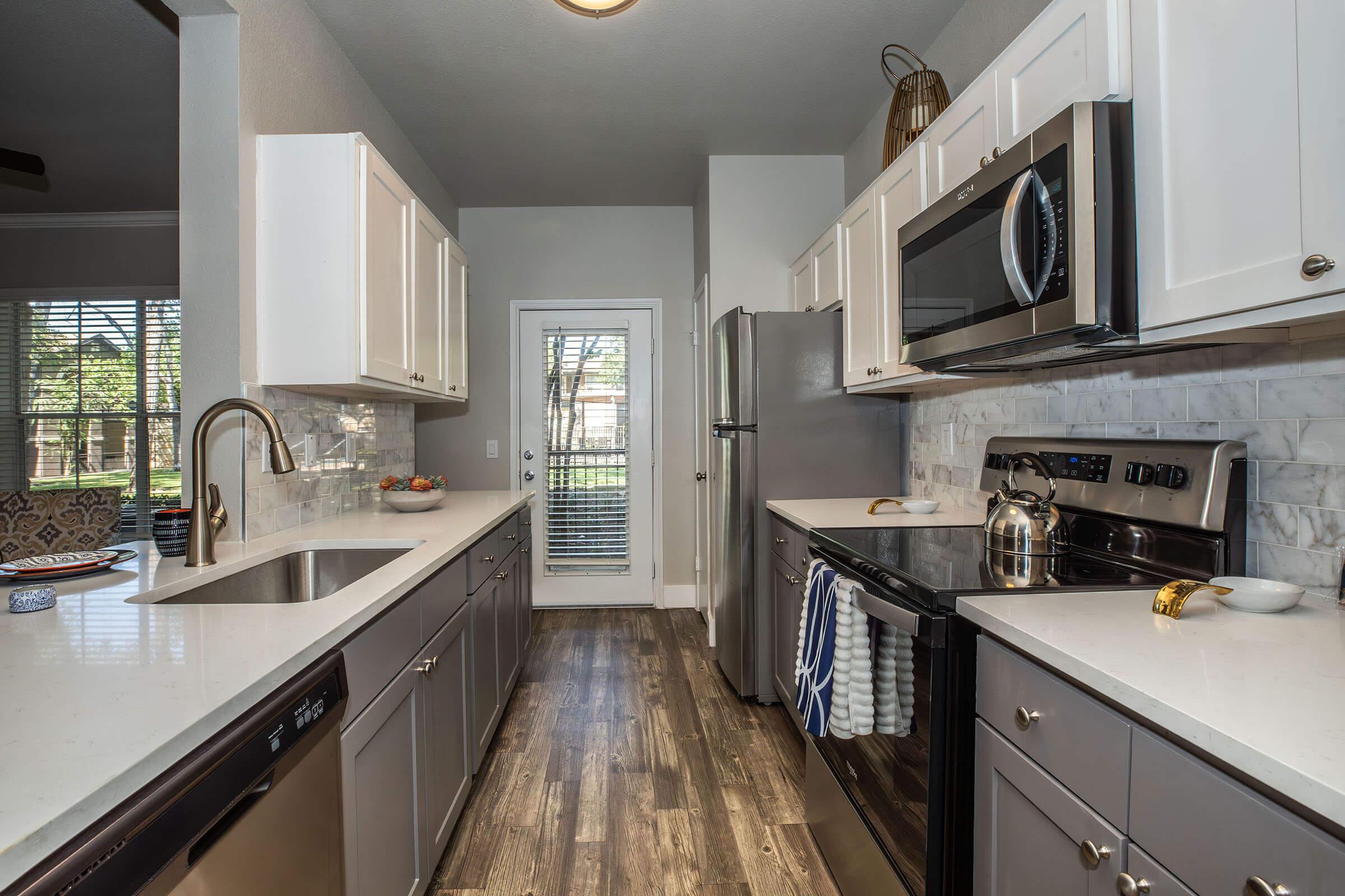 a kitchen with a sink and a window