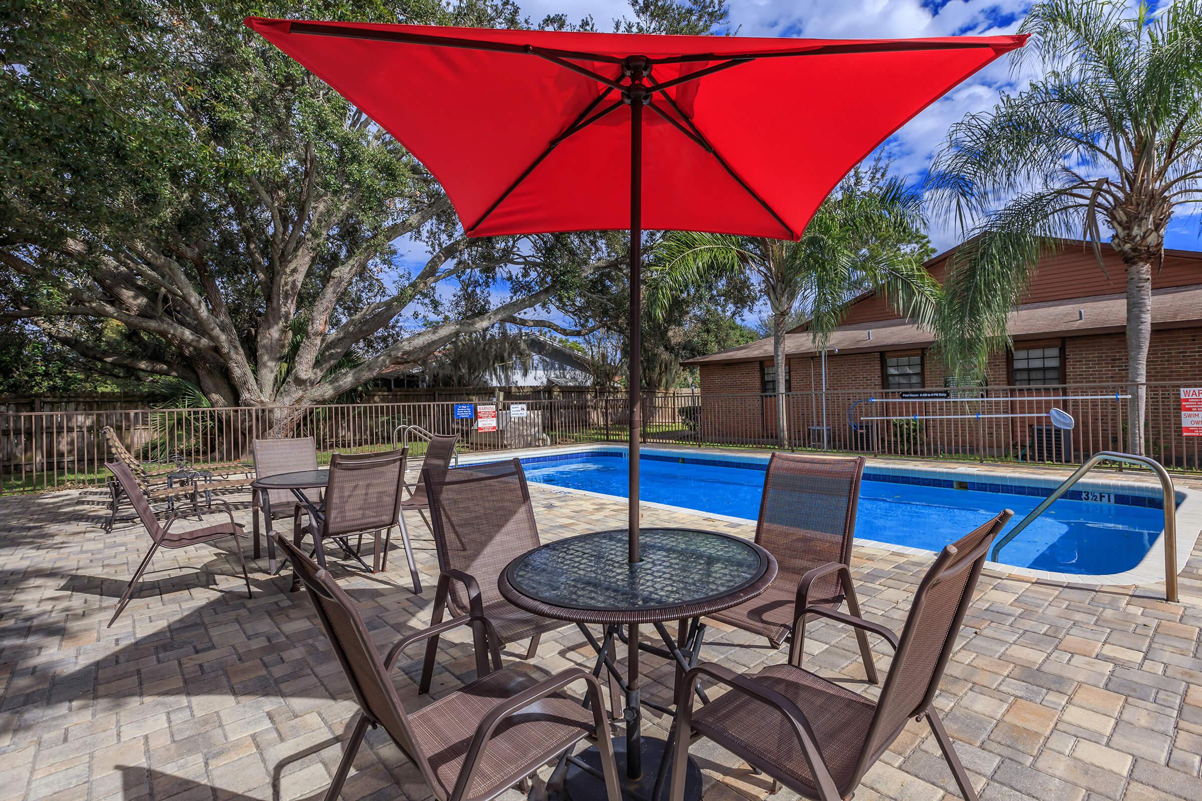 a table topped with a blue umbrella