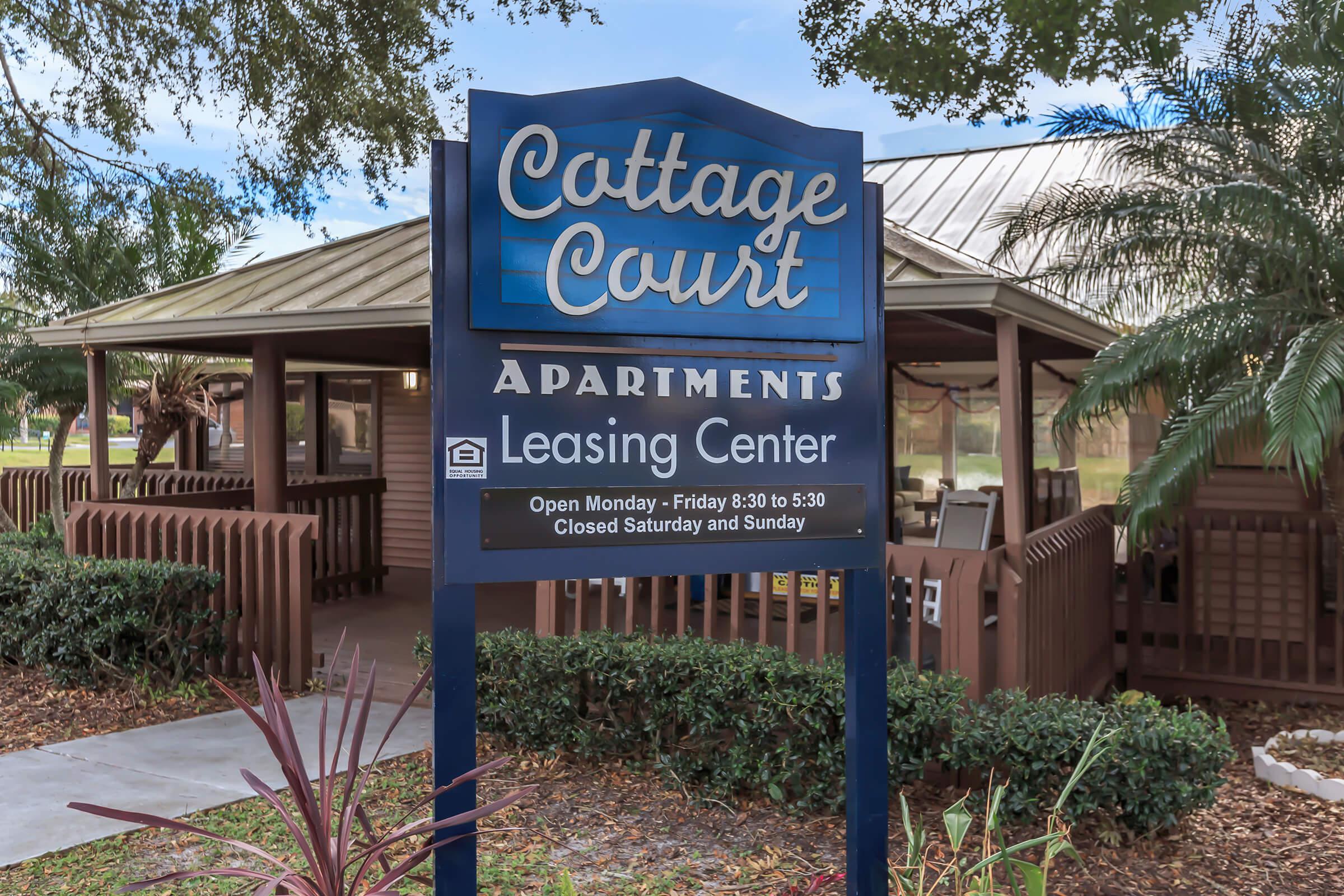 a sign in front of a house